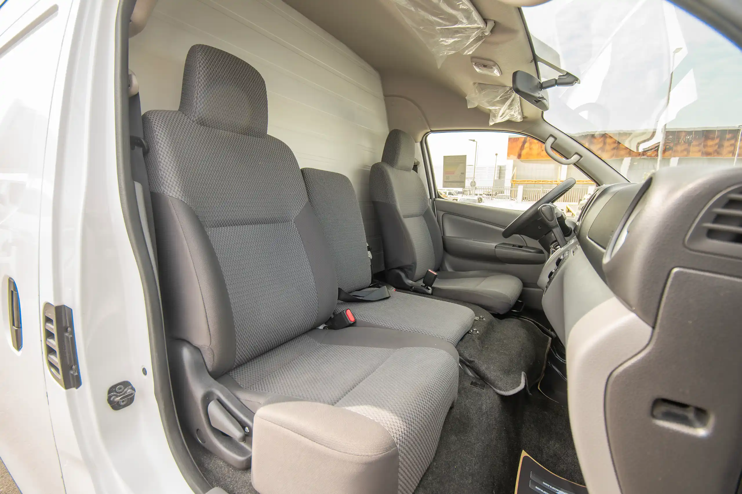 Used 2022 Nissan Urvan High Roof White – Front Passenger Side Cabin View at First Choice Cars Sharjah
