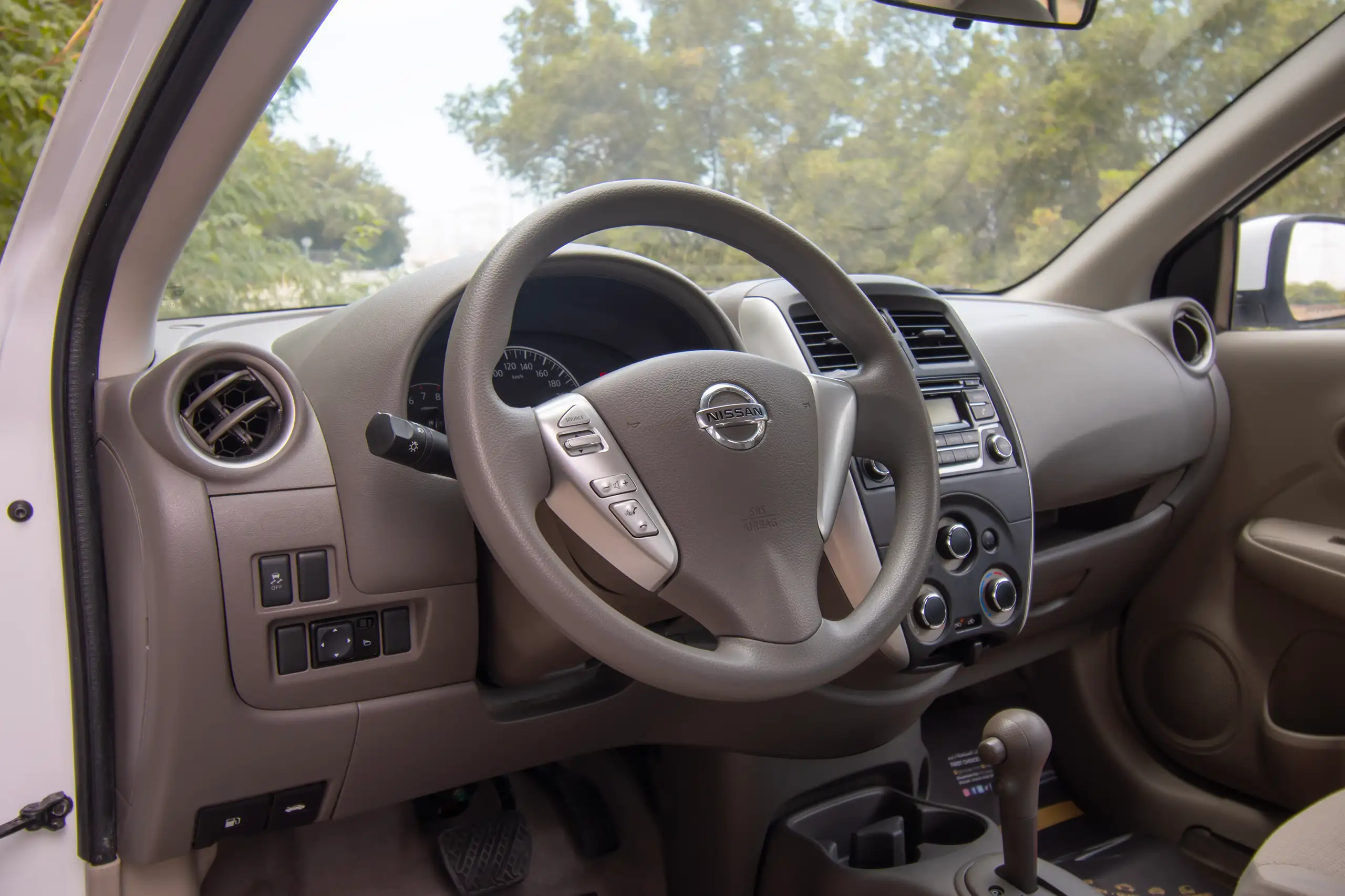 Used 2022 Nissan Sunny SV White – Driver Side Dashboard & Steering View at First Choice Cars Sharjah