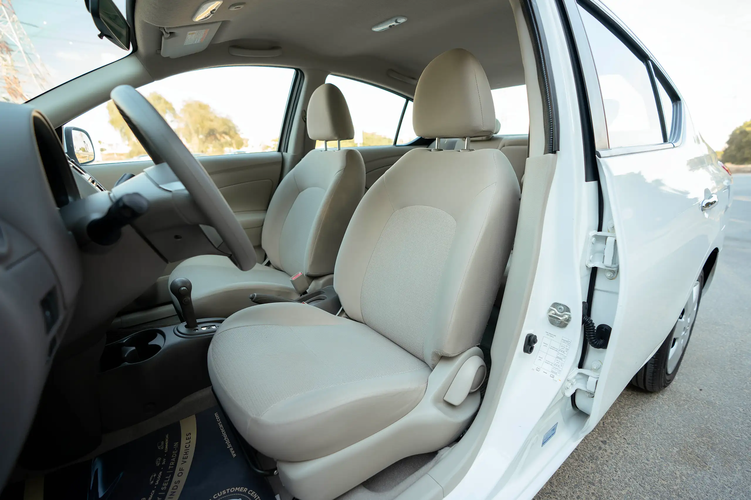 Used 2022 Nissan Sunny SV in White – Front Driver Side Cabin View for Sale at First Choice Cars Dubai Sharjah