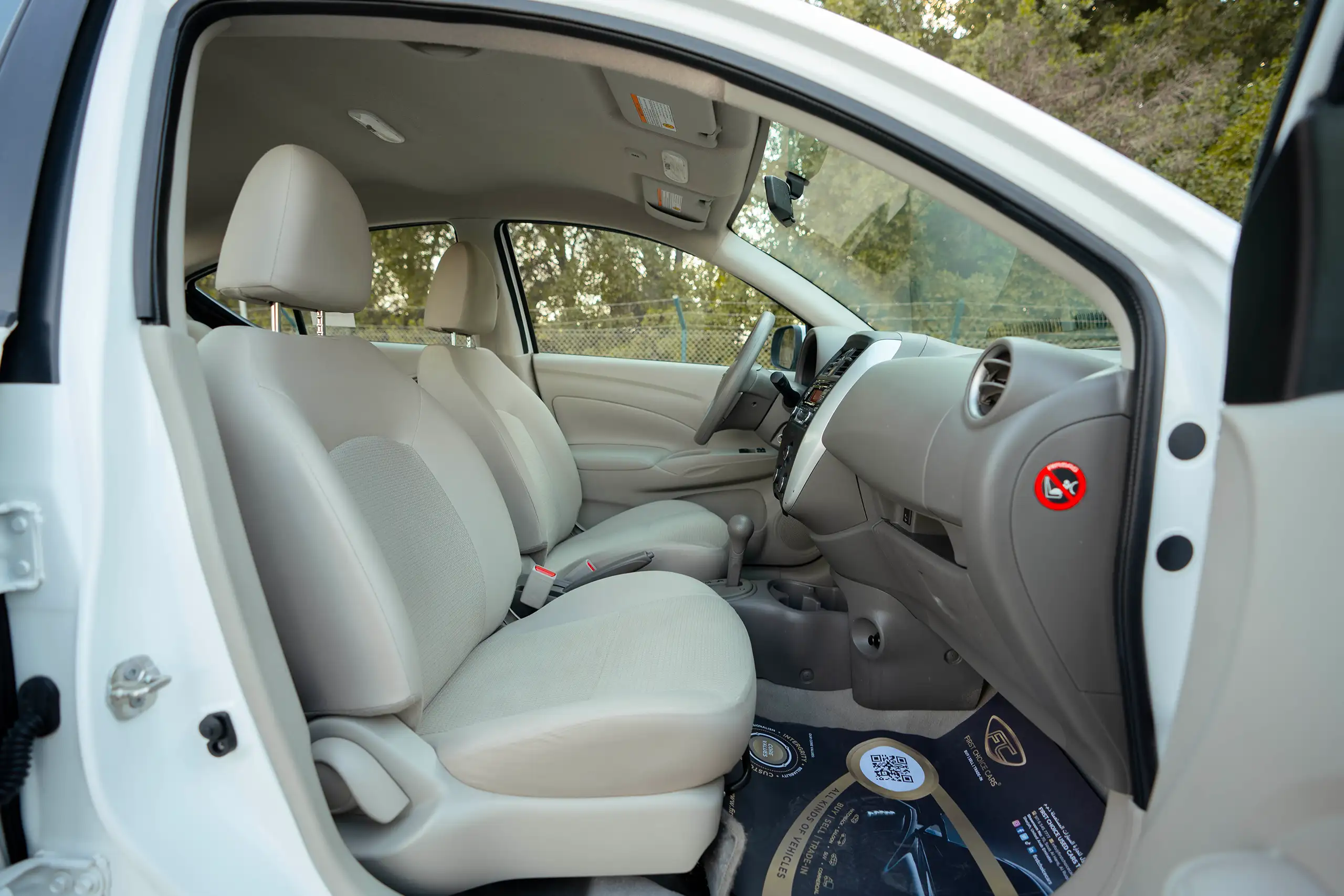 Used 2022 Nissan Sunny SV in White – Front Passenger Side Cabin View for Sale at First Choice Cars Dubai Sharjah