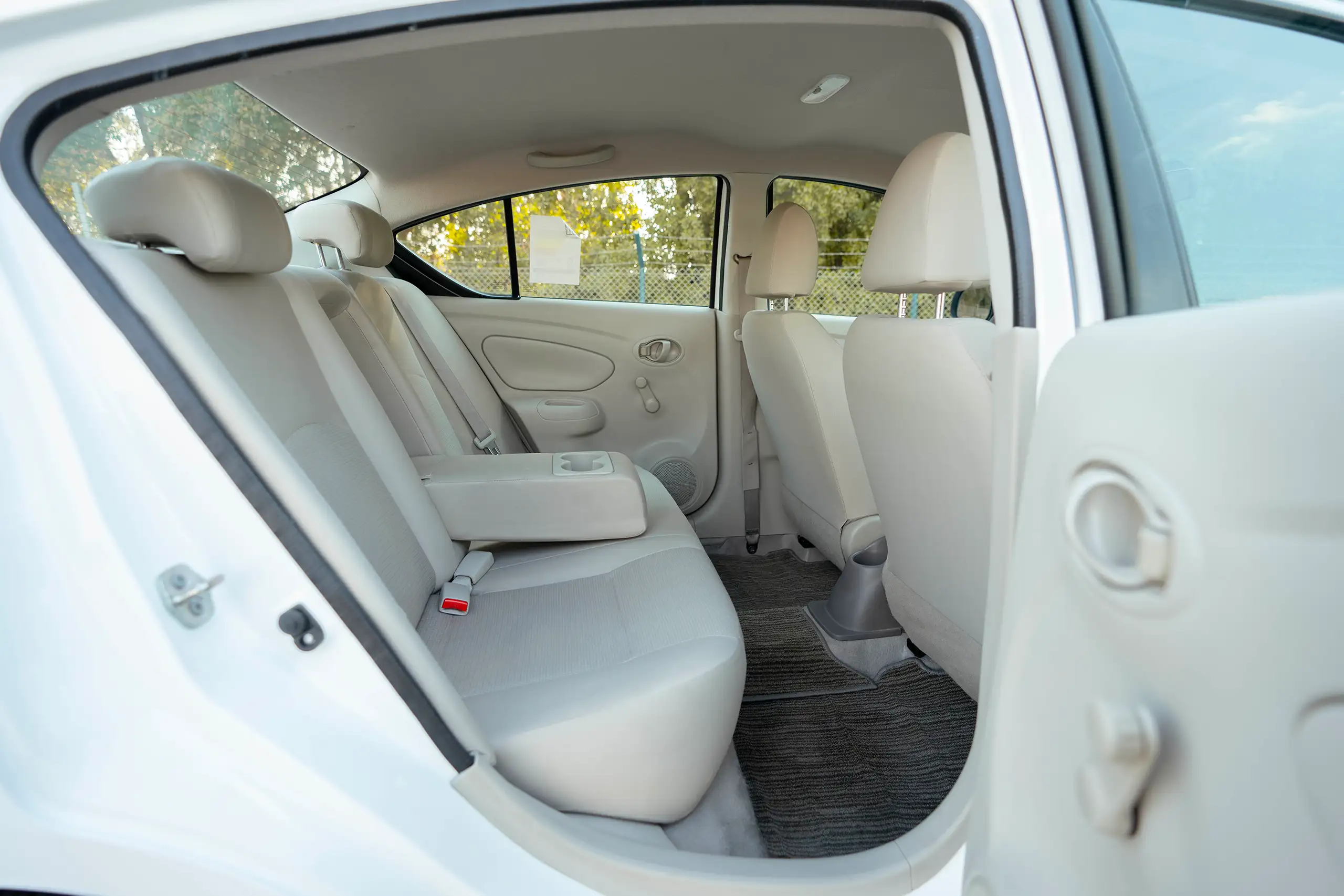 Used 2022 Nissan Sunny SV in White – Rear Passenger Side Cabin View for Sale at First Choice Cars Dubai Sharjah