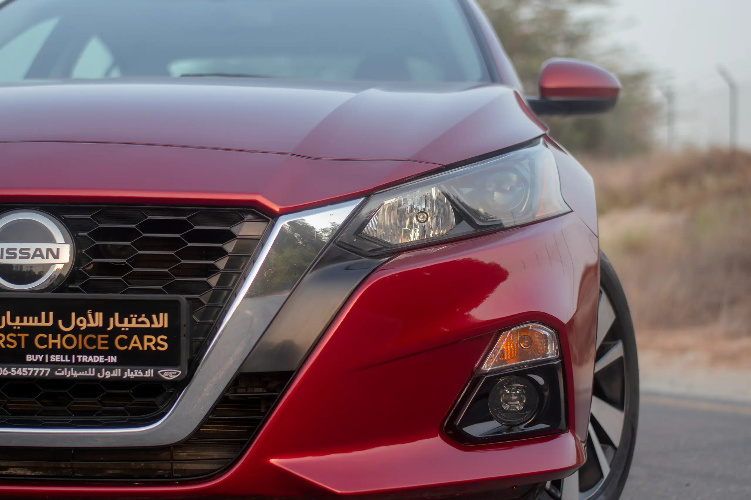 Used 2022 Nissan Altima SV Red – Headlight Close-up at First Choice Cars Sharjah
