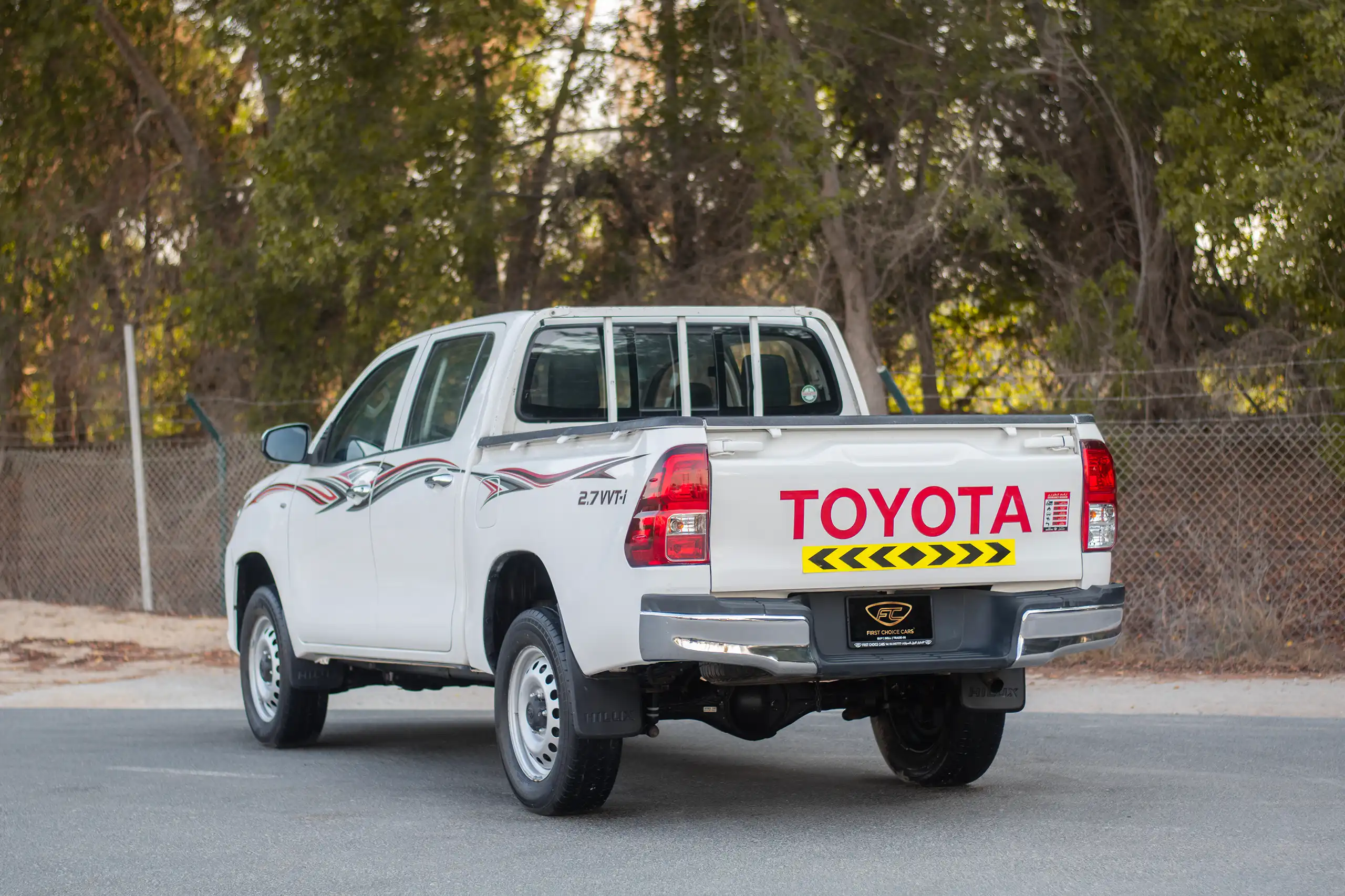 Used 2021 Toyota Hilux GL Double Cabin White – Left Back Diagonal (45°) View at First Choice Cars Sharjah