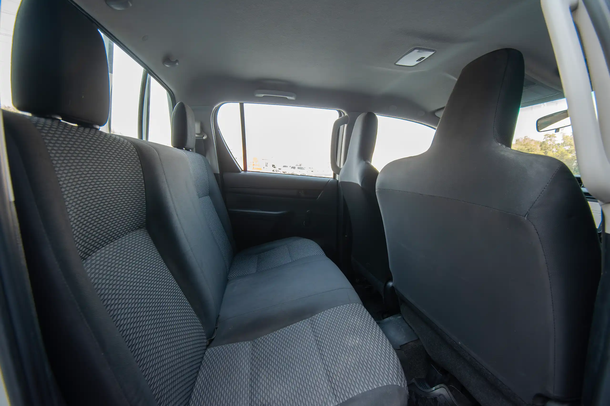 Used 2021 Toyota Hilux GL Double Cabin White – Rear Passenger Side Cabin View at First Choice Cars Sharjah