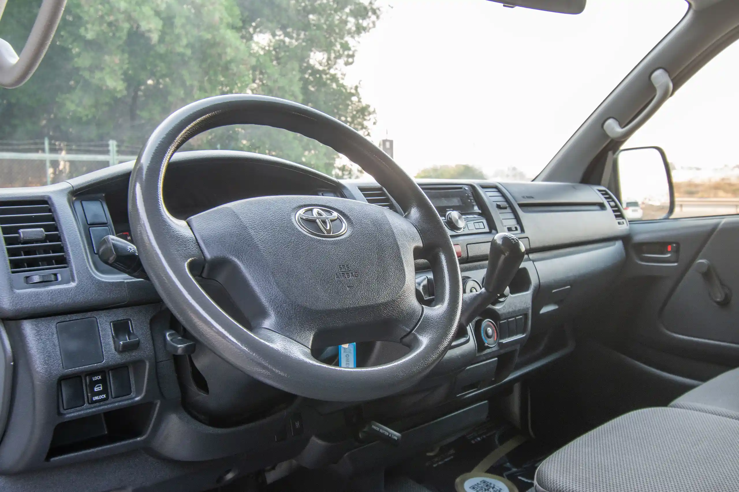 Used 2021 Toyota Hiace GL Standard Roof White – Driver Side Dashboard & Steering View at First Choice Cars Sharjah