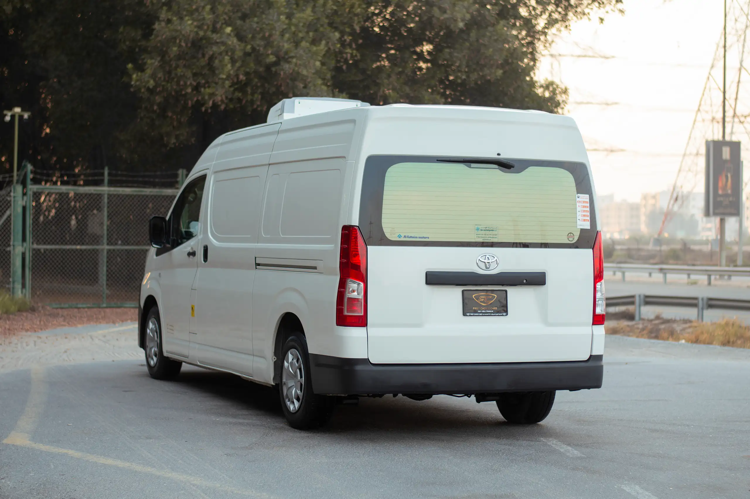 Used 2021 Toyota Hiace GL High Roof White – Left Back Diagonal (45°) View at First Choice Cars Sharjah