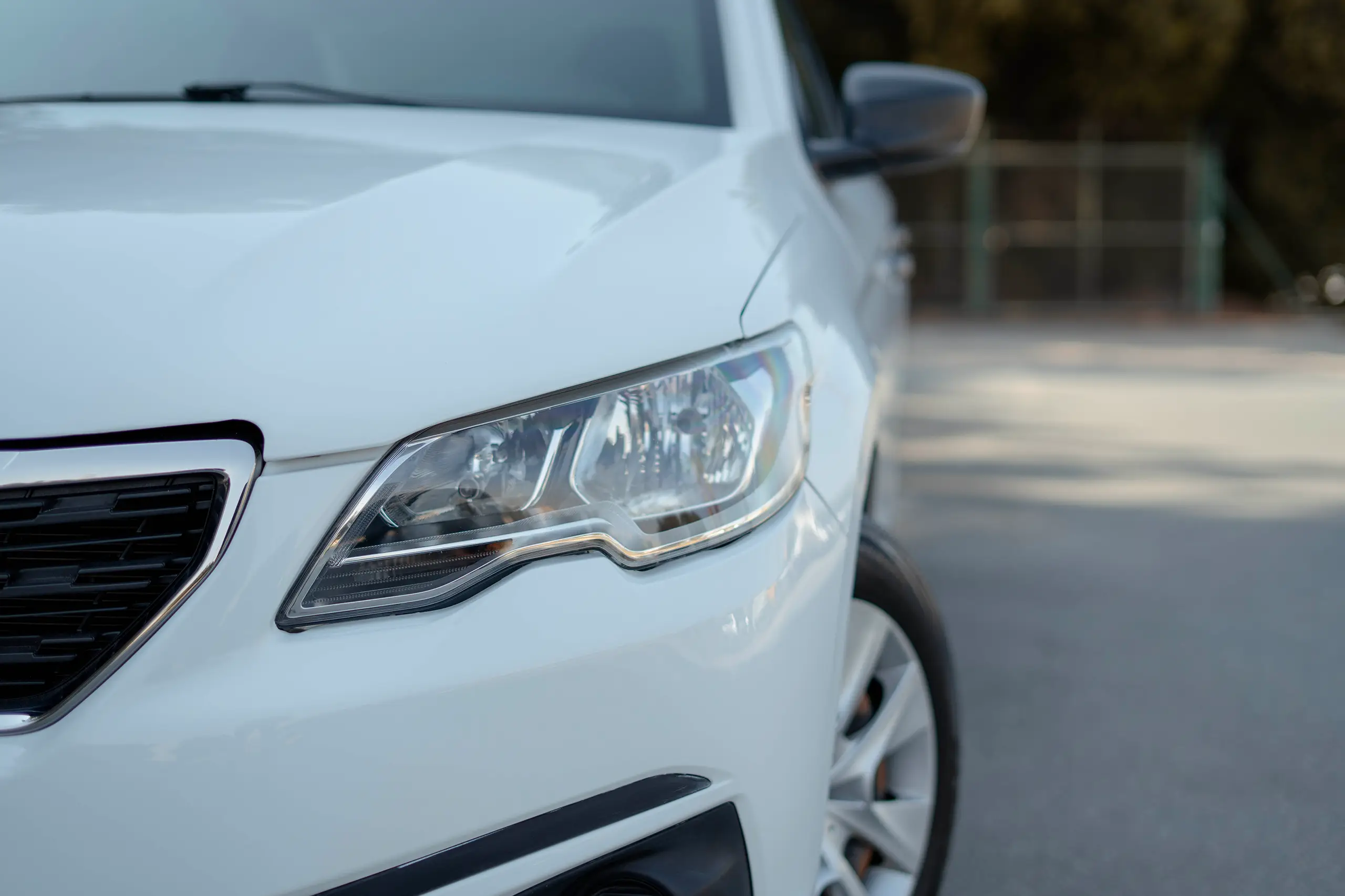 Used 2021 Peugeot 301 Allure in White – Headlight Close-up for Sale at First Choice Cars Dubai Sharjah