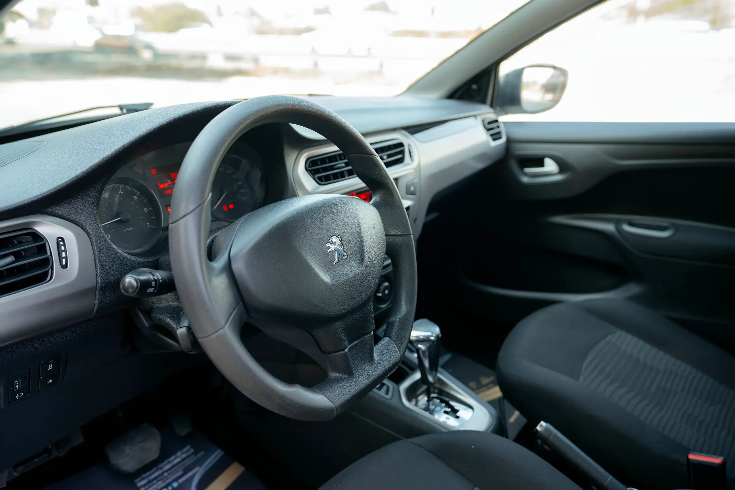 Used 2021 Peugeot 301 Allure in White – Driver Side Dashboard & Steering View for Sale at First Choice Cars Dubai Sharjah