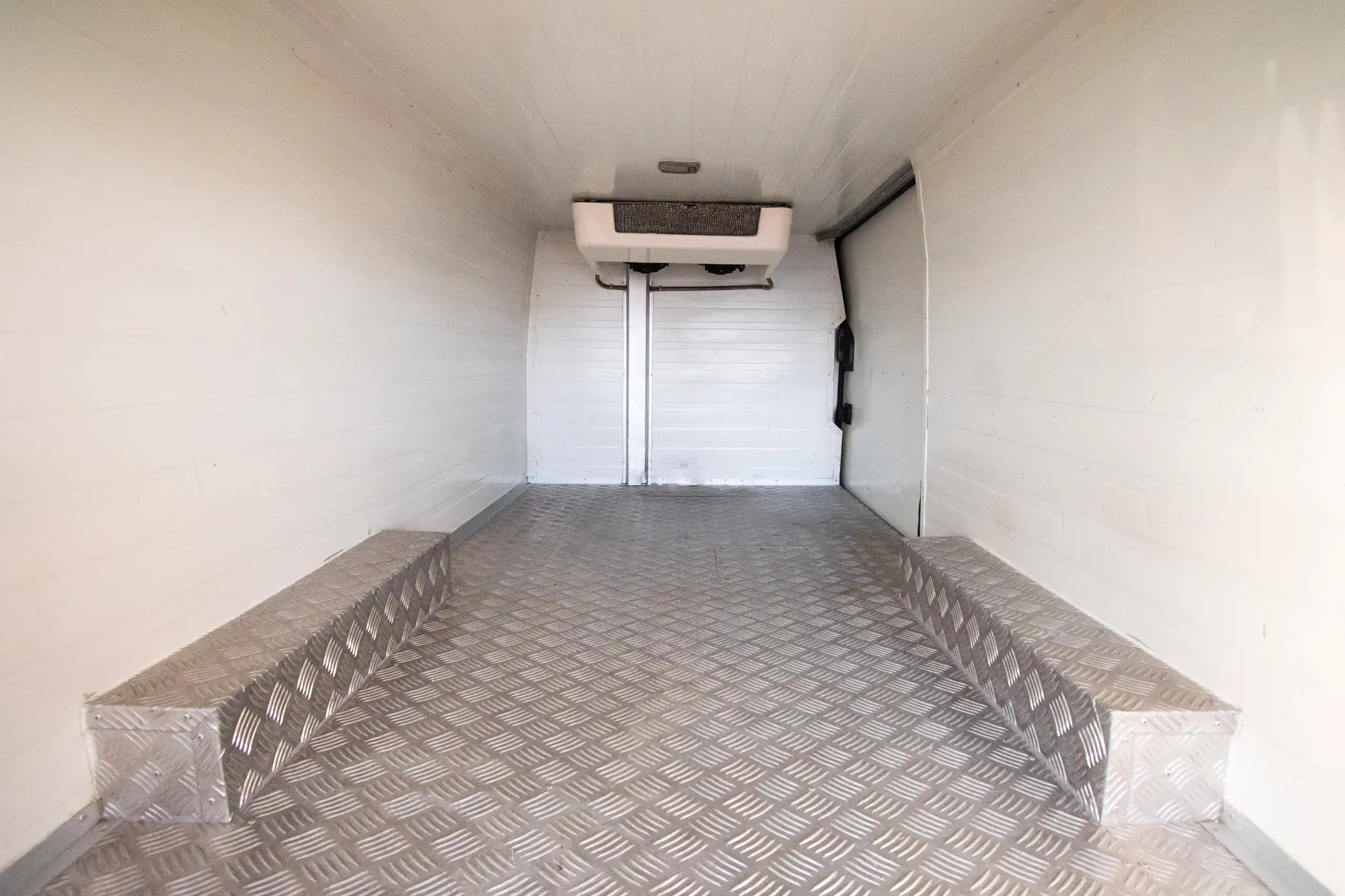 Used 2021 Nissan Urvan Standard Roof White – Delivery Box Rear Opening View at First Choice Cars Sharjah