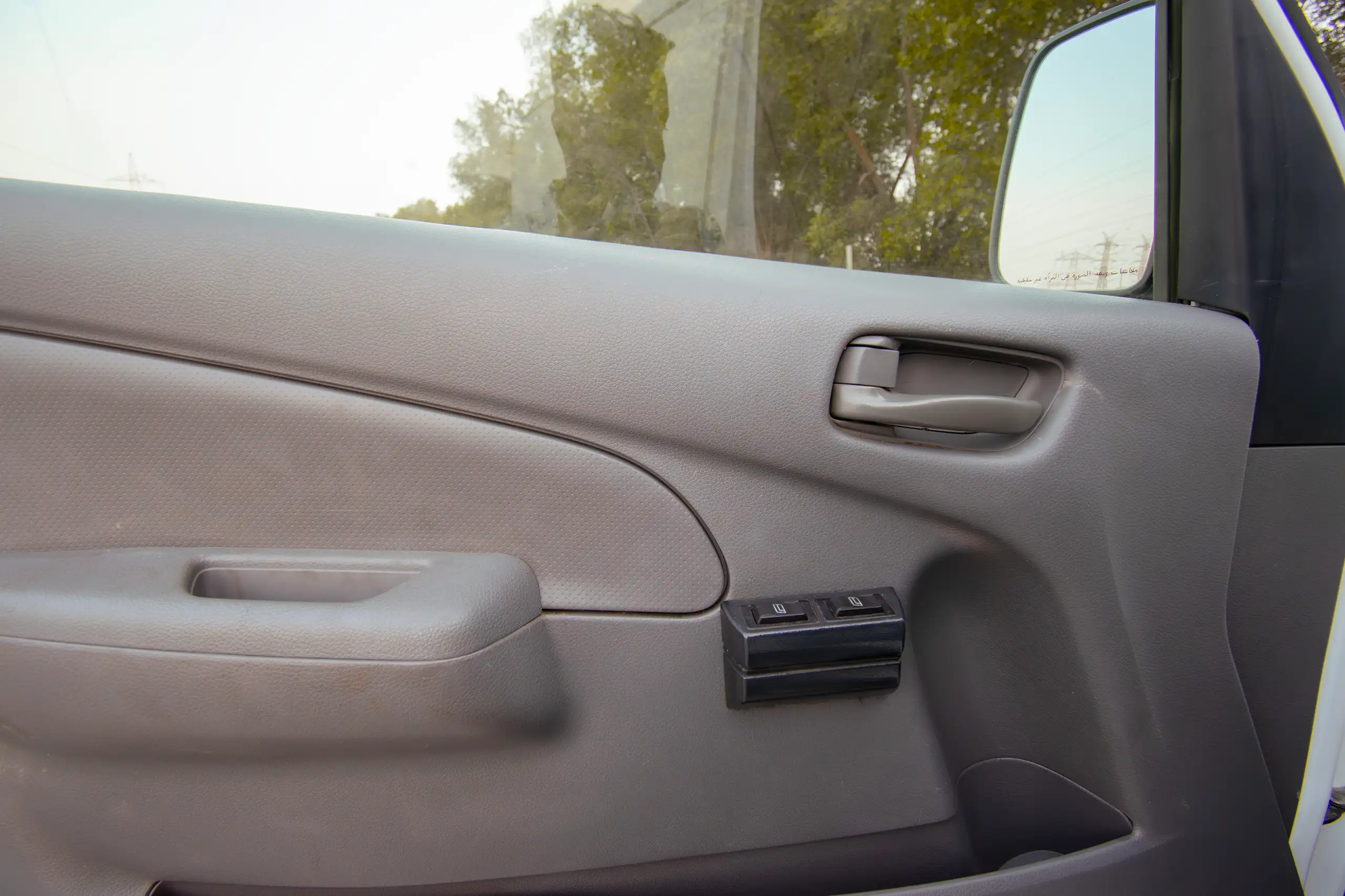 Used 2021 Nissan Urvan Standard Roof White – Driver Door Panel Full View at First Choice Cars Sharjah