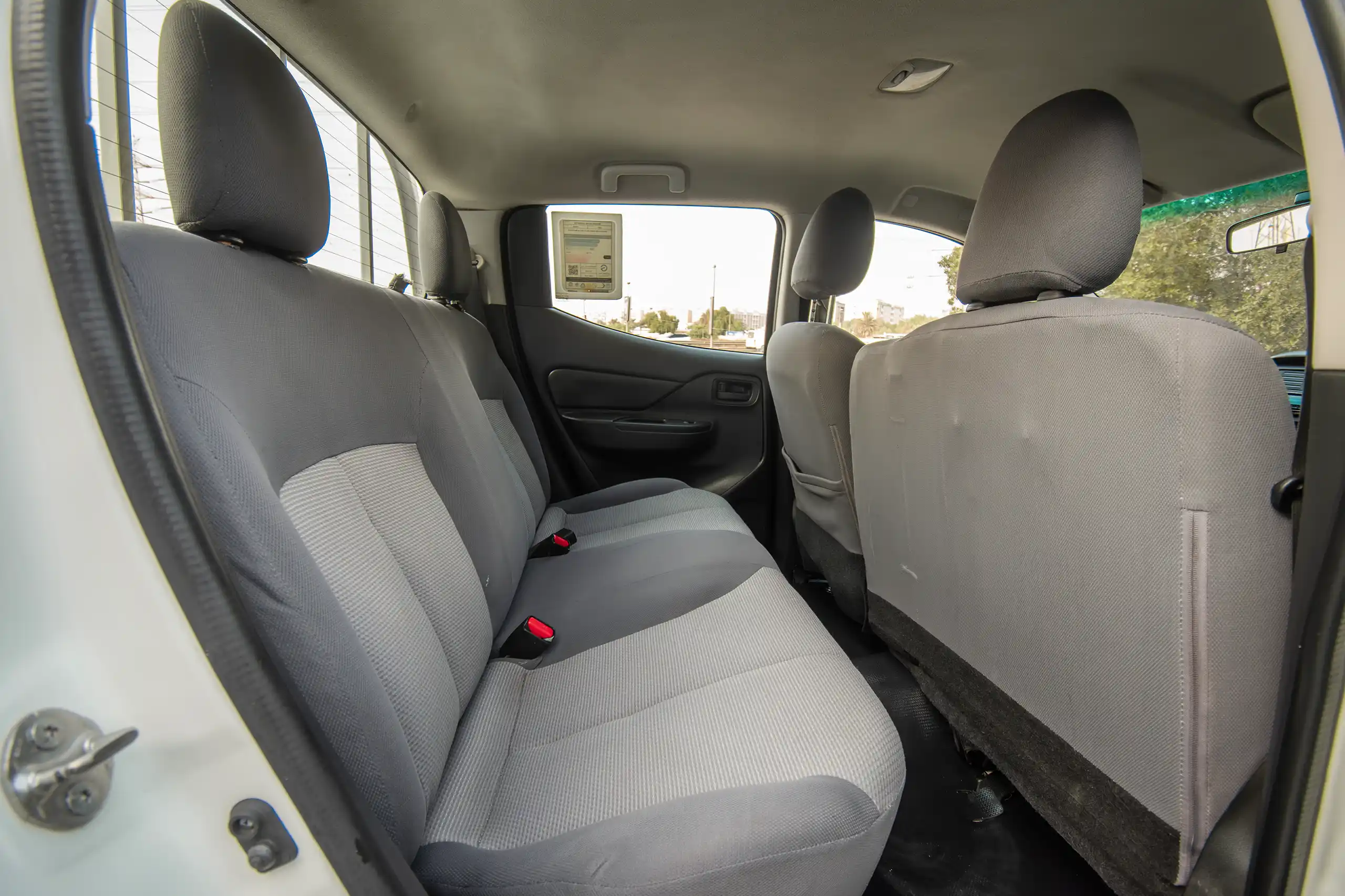 Used 2023 Mitsubishi L200 GL Double Cabin White – Rear Passenger Side Cabin View at First Choice Cars Sharjah