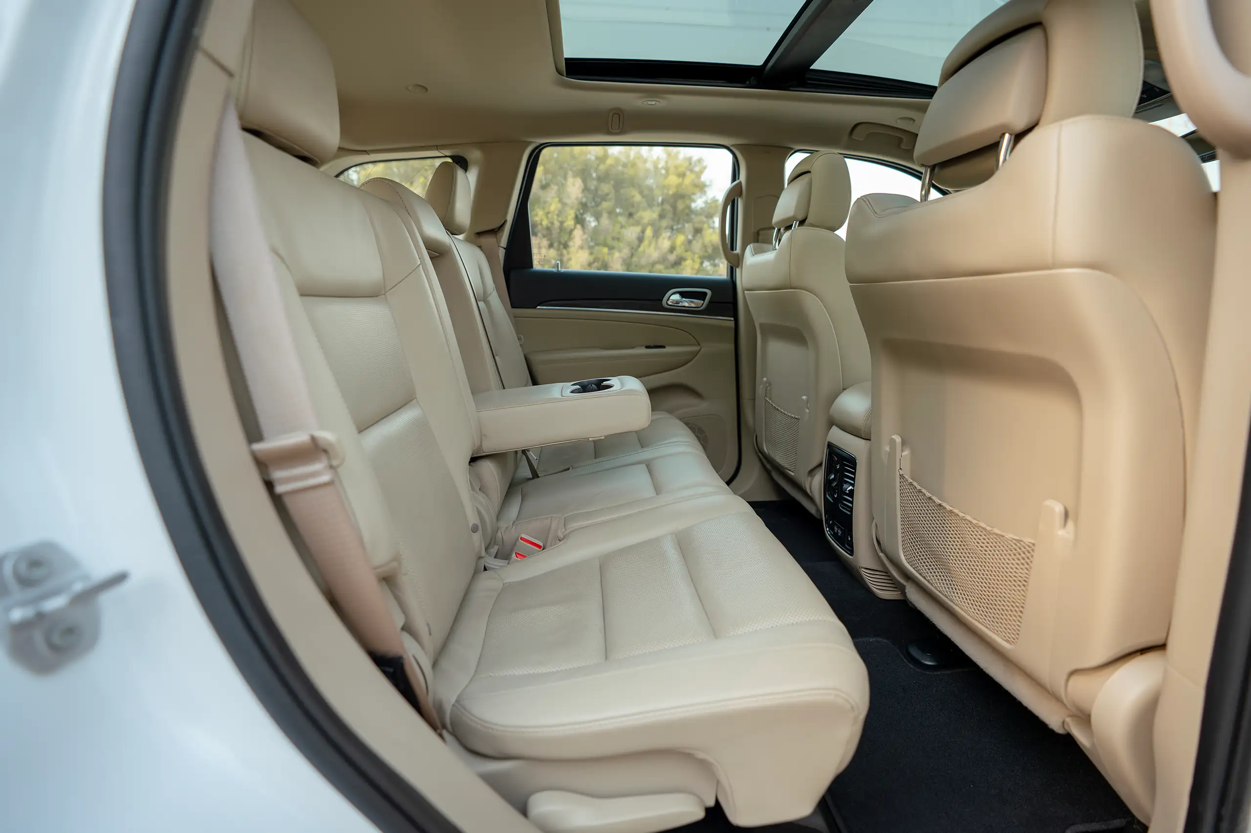 Used 2021 Jeep Grand Cherokee Limited White – Rear Passenger Side Cabin View at First Choice Cars Sharjah