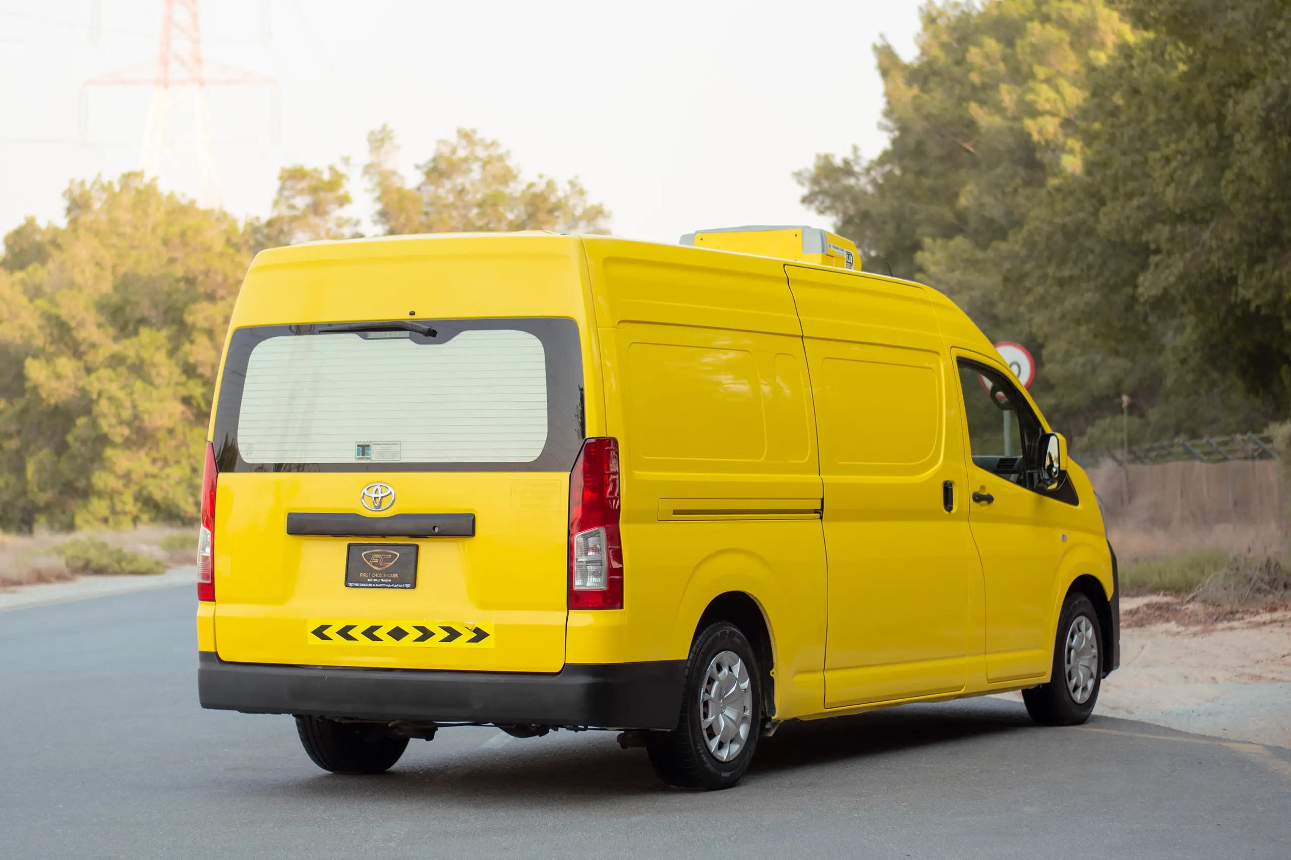 Used 2020 Toyota Hiace GL High Roof Yellow – Right Back Diagonal (45°) View at First Choice Cars Sharjah