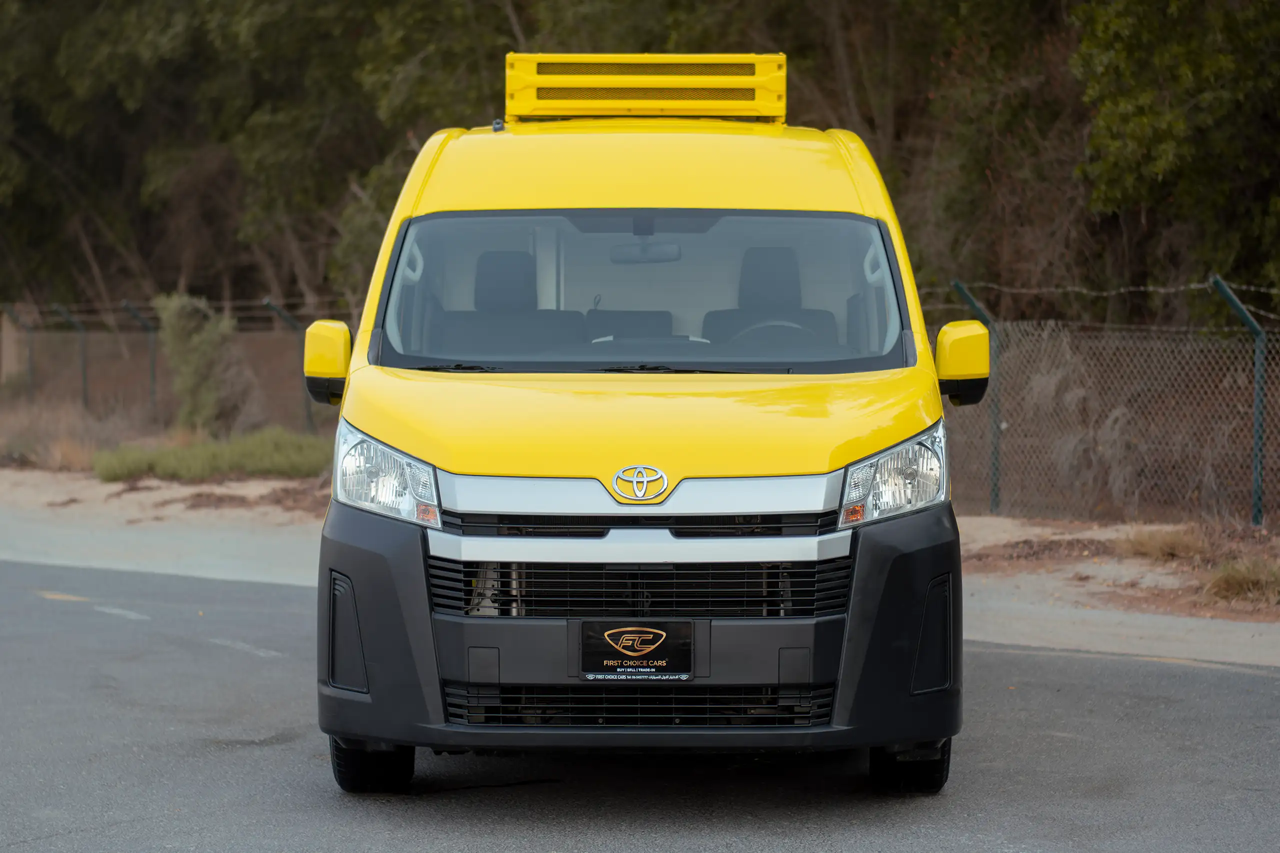 Used 2020 Toyota Hiace GL High Roof Yellow – Front View at First Choice Cars Sharjah