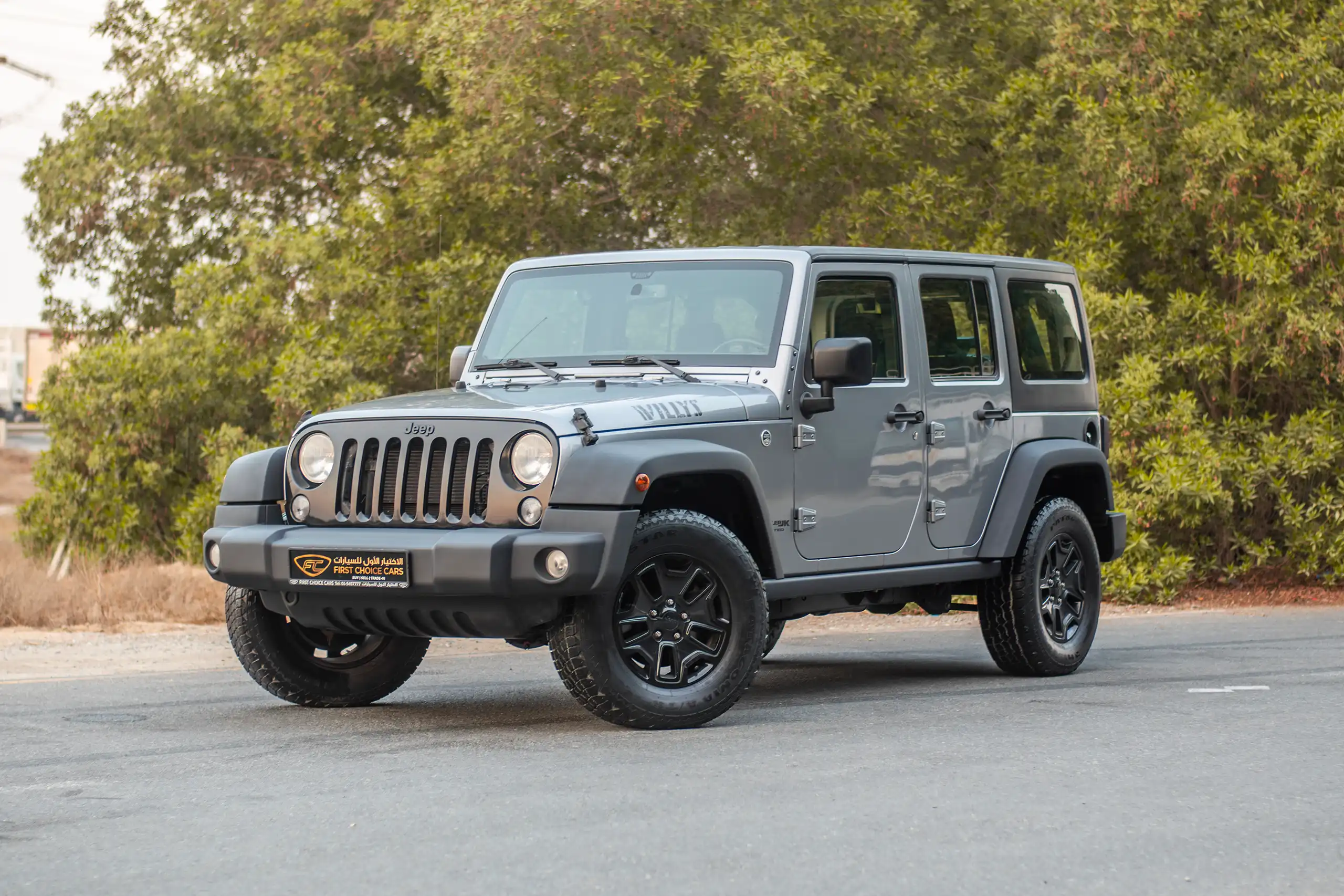 Used 2018 Jeep Wrangler Unlimited Willys Wheeler in Silver – Left Front Diagonal (45°) View for Sale at First Choice Cars Dubai Sharjah