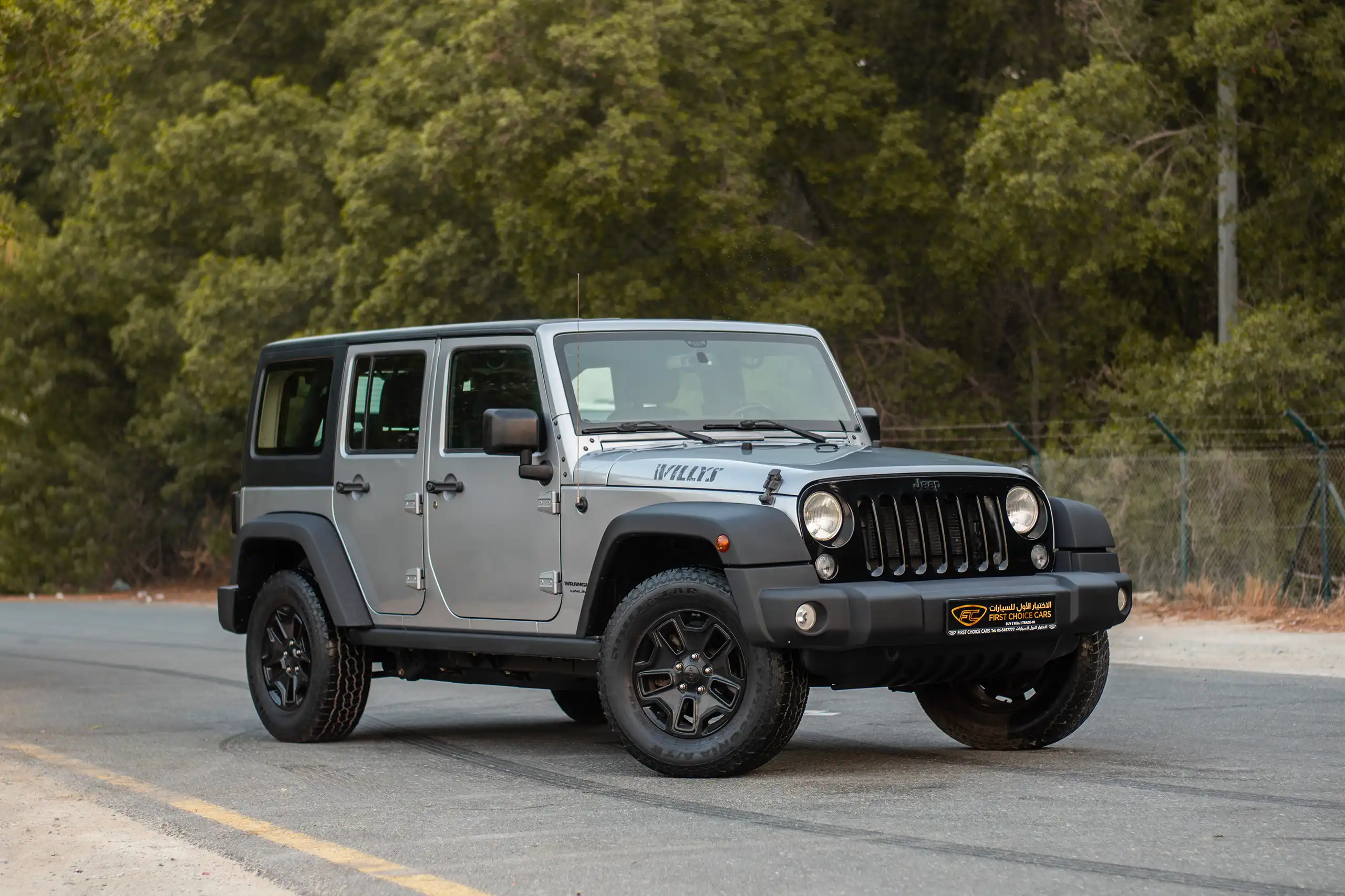 Used 2018 Jeep Wrangler Unlimited Willys Wheeler in Silver – Right Front Diagonal (45°) View for Sale at First Choice Cars Dubai Sharjah