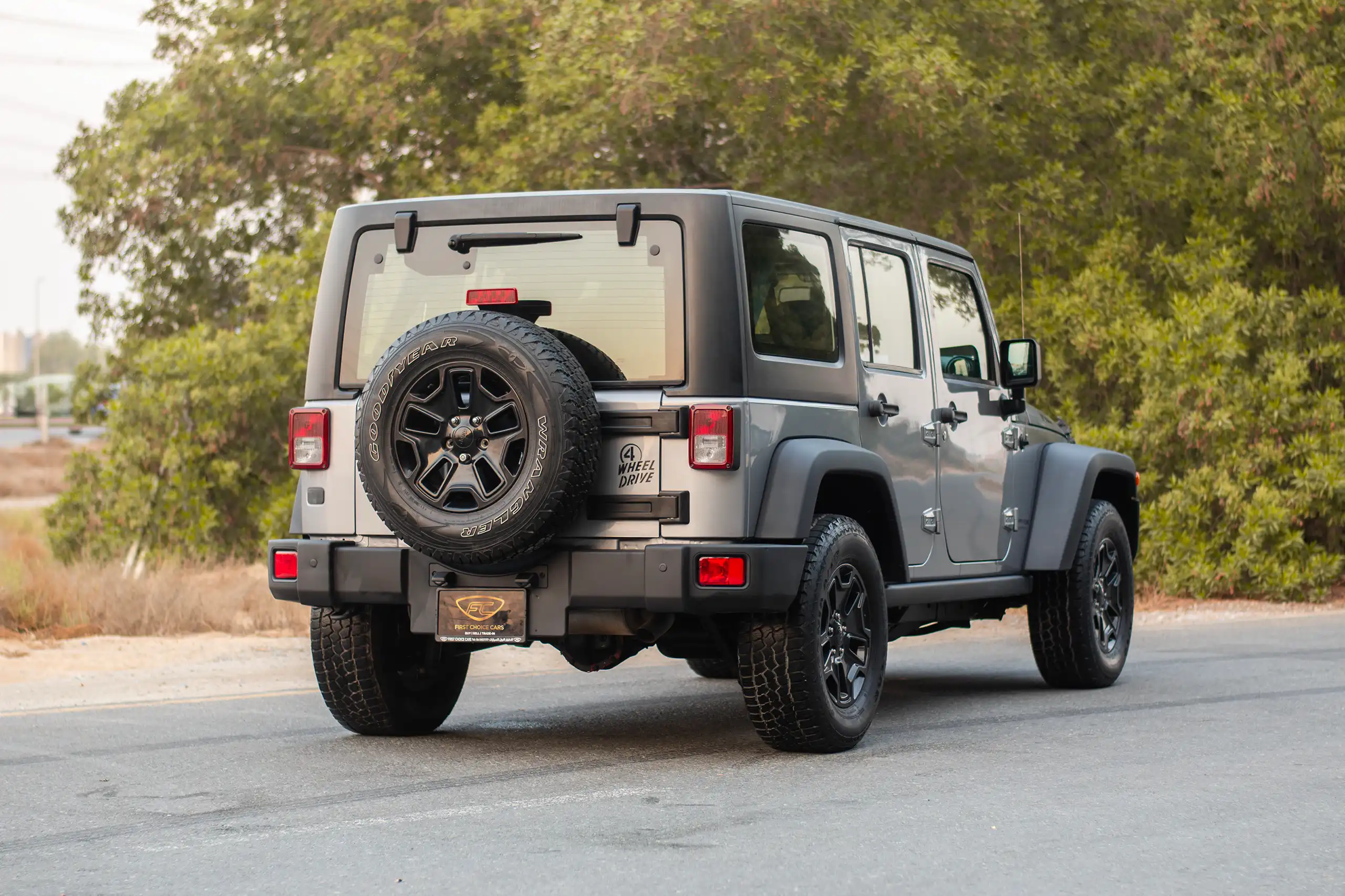 Used 2018 Jeep Wrangler Unlimited Willys Wheeler in Silver – Right Back Diagonal (45°) View for Sale at First Choice Cars Dubai Sharjah