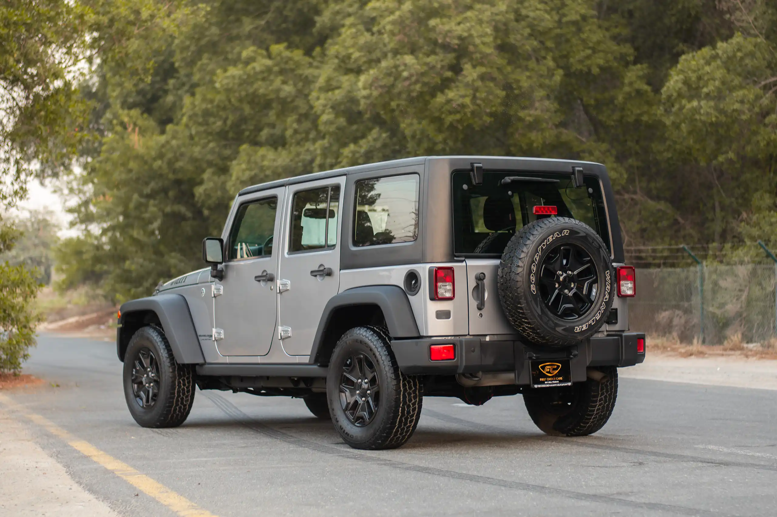 Used 2018 Jeep Wrangler Unlimited Willys Wheeler in Silver – Left Back Diagonal (45°) View for Sale at First Choice Cars Dubai Sharjah