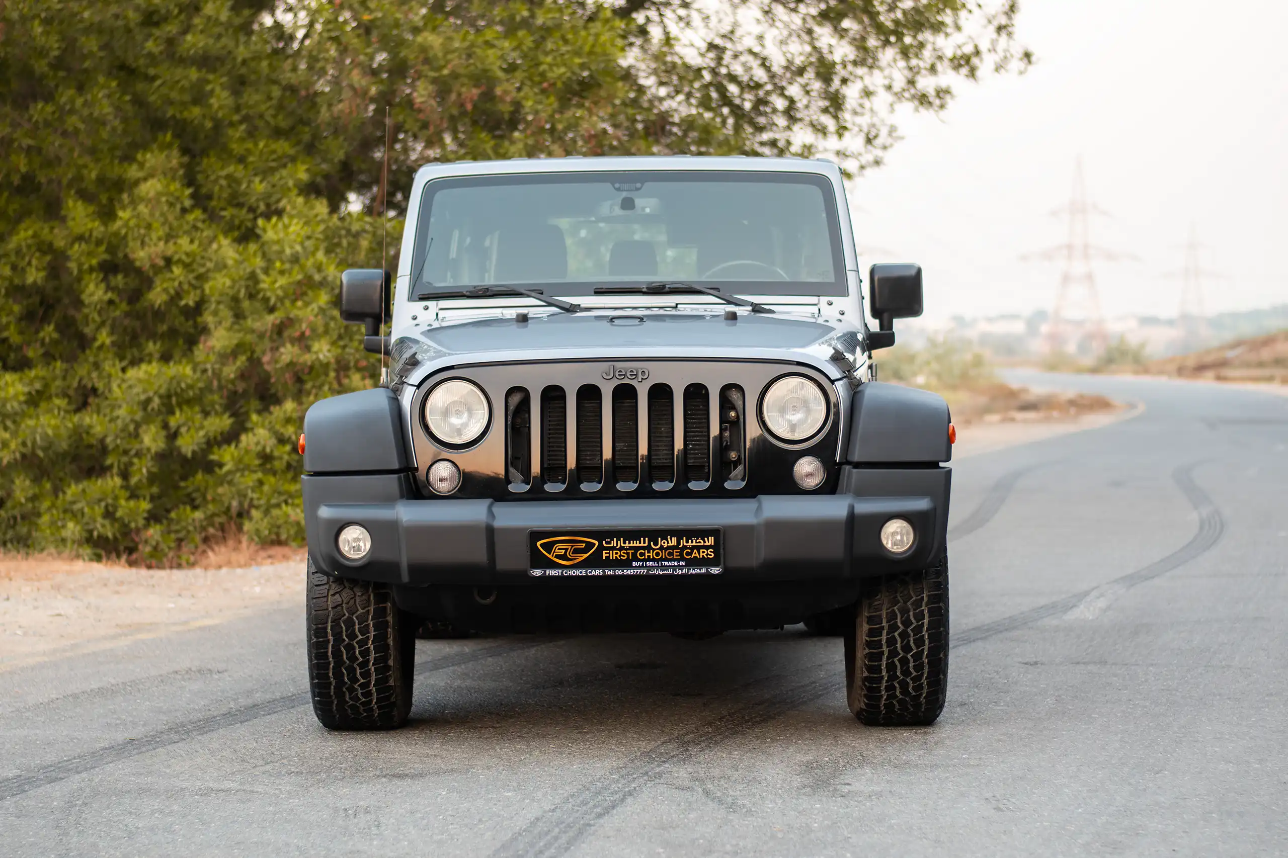 Used 2018 Jeep Wrangler Unlimited Willys Wheeler in Silver – Front View for Sale at First Choice Cars Dubai Sharjah