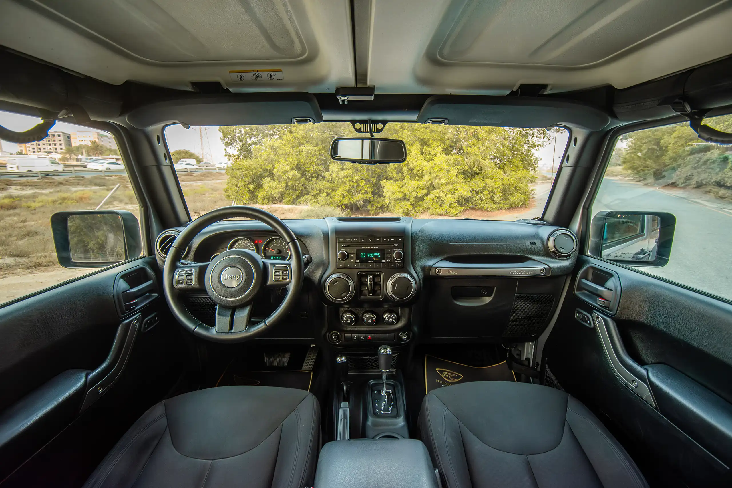 Used 2018 Jeep Wrangler Unlimited Willys Wheeler in Silver – Front Cabin / Dashboard Full View for Sale at First Choice Cars Dubai Sharjah