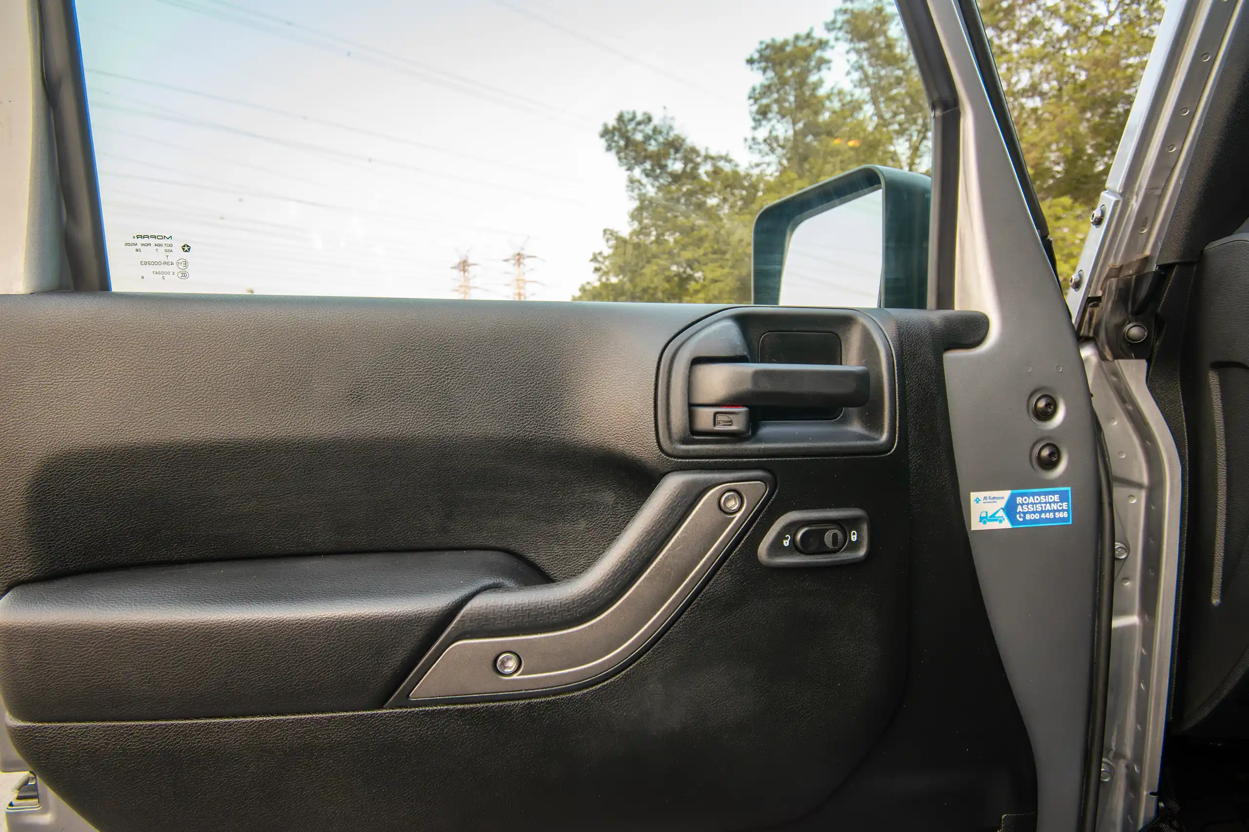 Used 2018 Jeep Wrangler Unlimited Willys Wheeler in Silver – Driver Door Panel Full View for Sale at First Choice Cars Dubai Sharjah