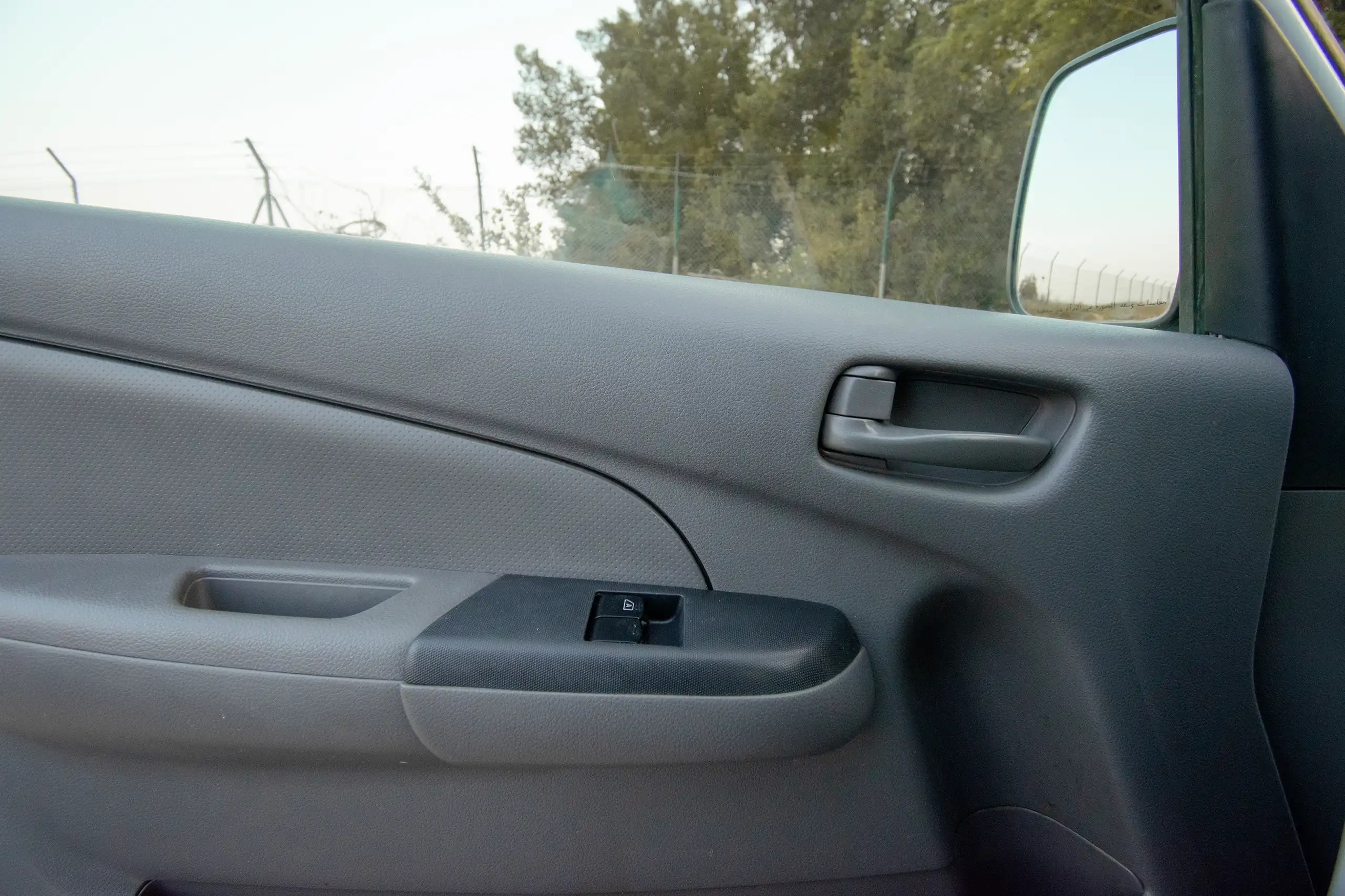 Used 2016 Nissan Urvan Standard Roof White – Driver Door Panel Full View at First Choice Cars Sharjah