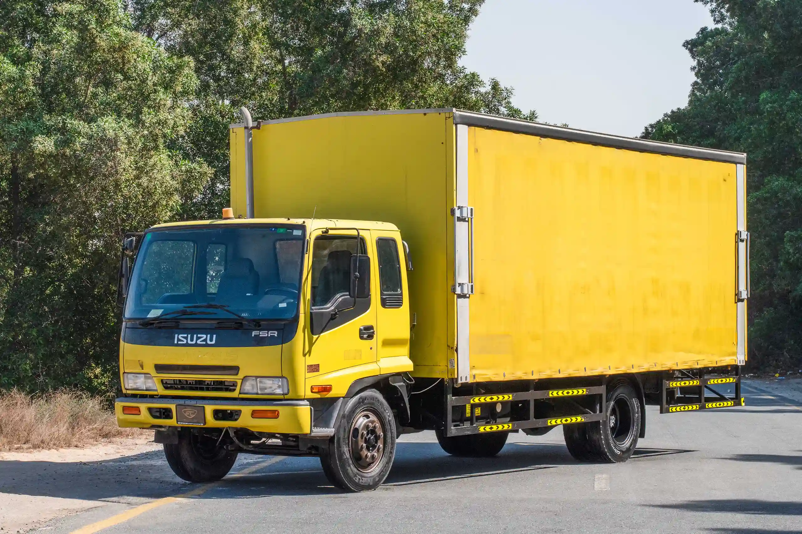 Used 2016 Isuzu FSR Cargo Body in Yellow – Left Front Diagonal (45°) View for Sale at First Choice Cars Dubai Sharjah