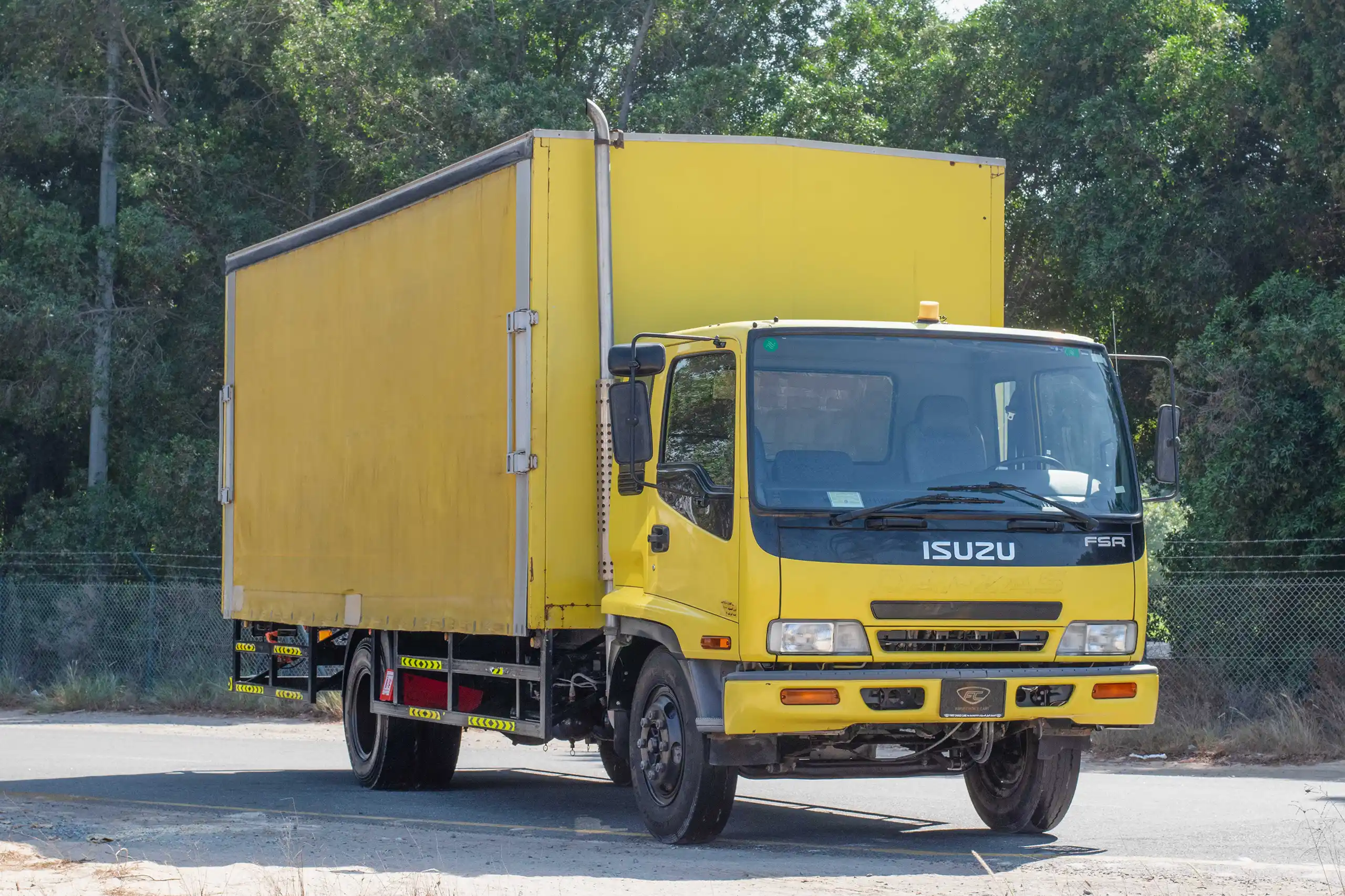 Used 2016 Isuzu FSR Cargo Body in Yellow – Right Front Diagonal (45°) View for Sale at First Choice Cars Dubai Sharjah