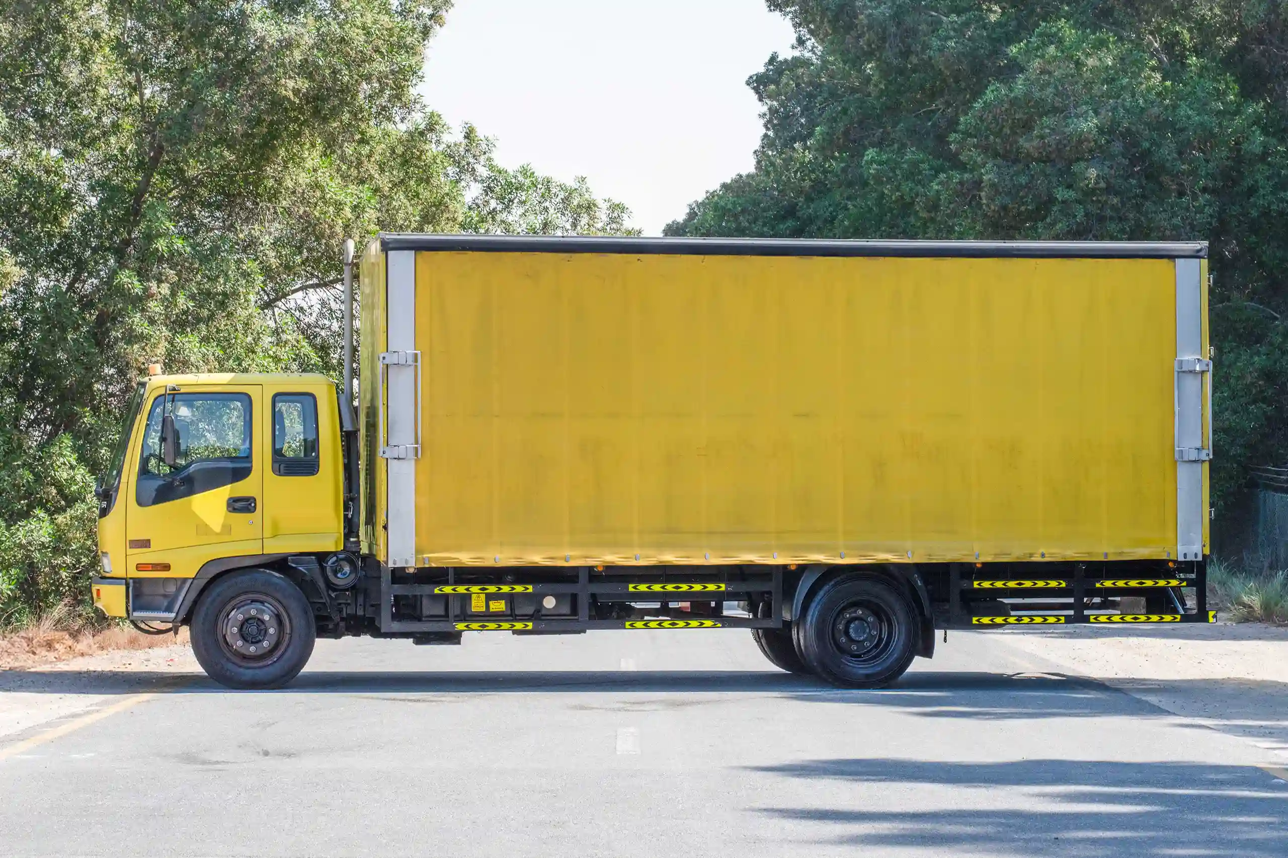 Used 2016 Isuzu FSR Cargo Body in Yellow – Left Back Diagonal (45°) View for Sale at First Choice Cars Dubai Sharjah