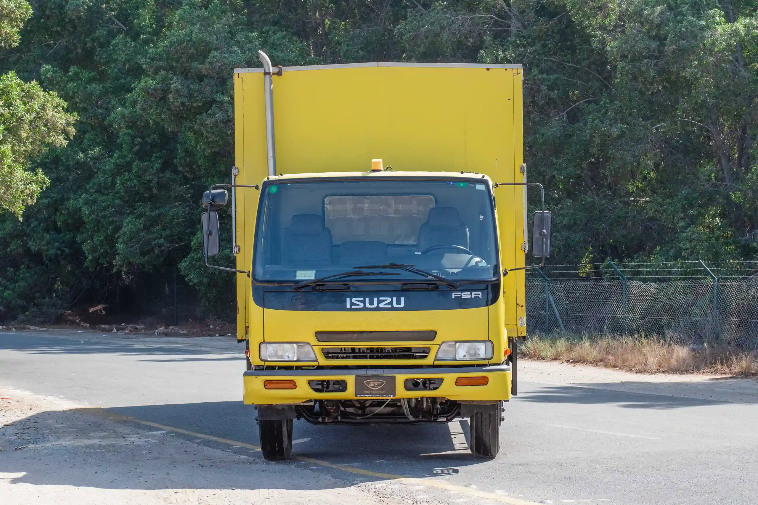 Used 2016 Isuzu FSR Cargo Body in Yellow – Front View for Sale at First Choice Cars Dubai Sharjah