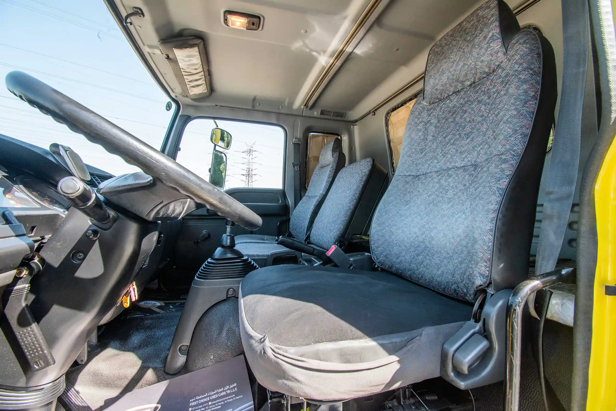 Used 2016 Isuzu FSR Cargo Body in Yellow – Front Driver Side Cabin View for Sale at First Choice Cars Dubai Sharjah