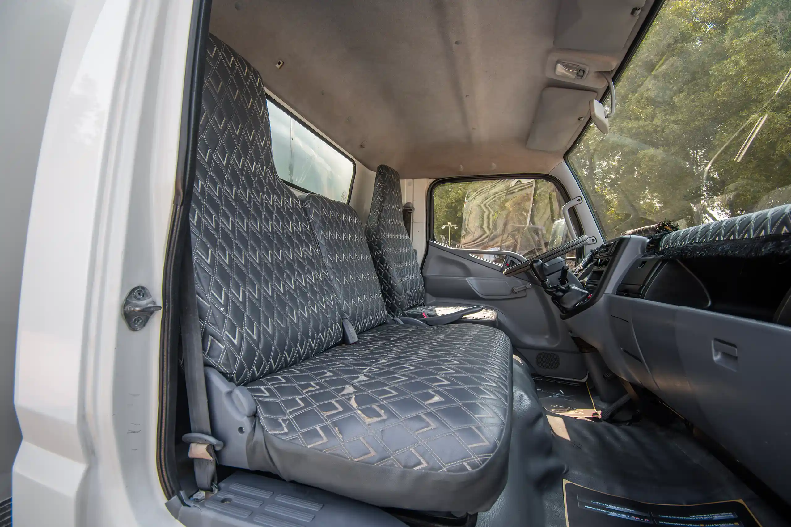 Used 2008 Mitsubishi Canter Cargo Box in White – Front Passenger Side Cabin View for Sale at First Choice Cars Dubai Sharjah