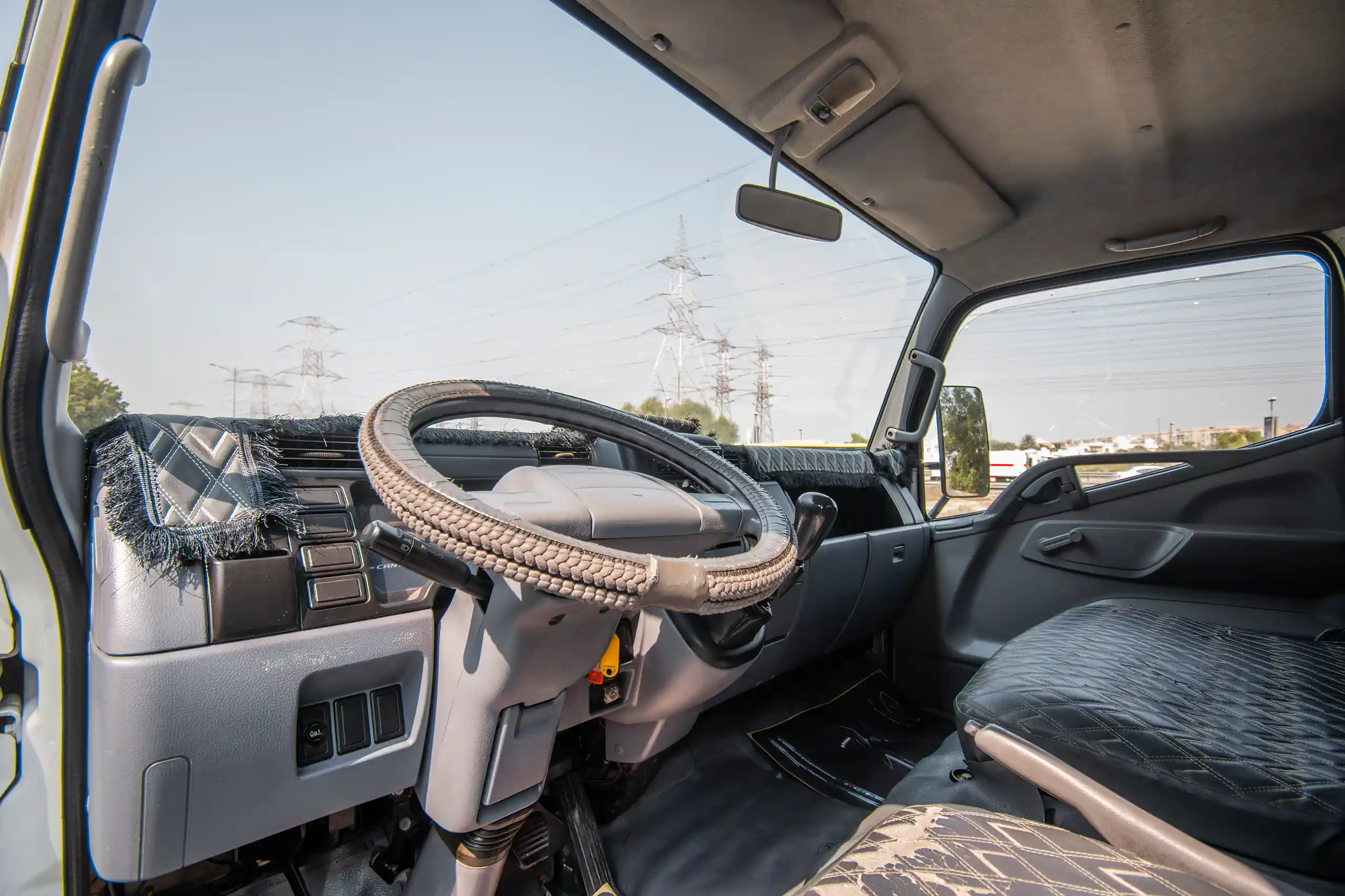 Used 2008 Mitsubishi Canter Cargo Box in White – Driver Side Dashboard & Steering View for Sale at First Choice Cars Dubai Sharjah
