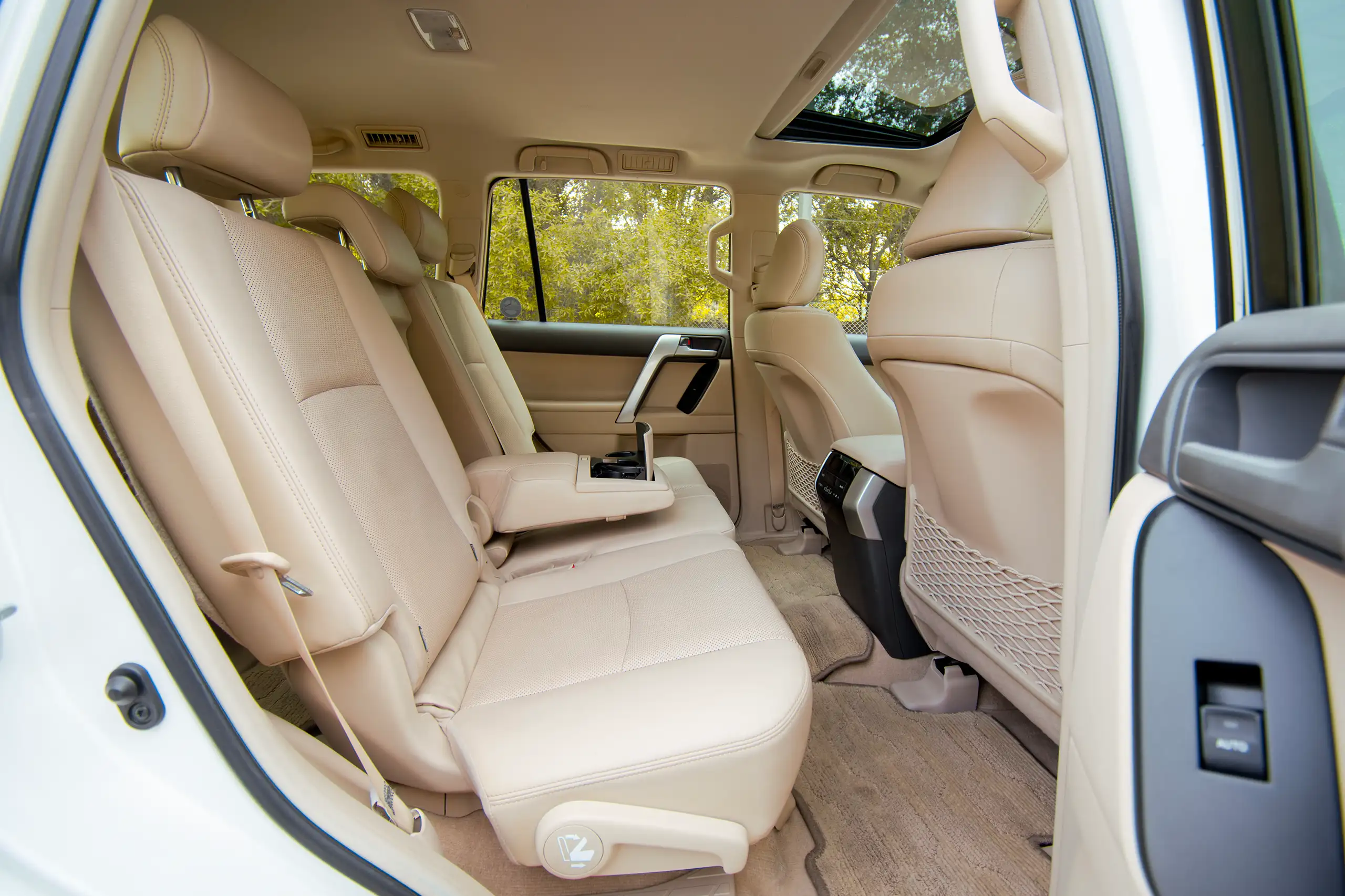 Used 2020 Toyota Prado VXR White – Rear Passenger Side Cabin View at First Choice Cars Sharjah