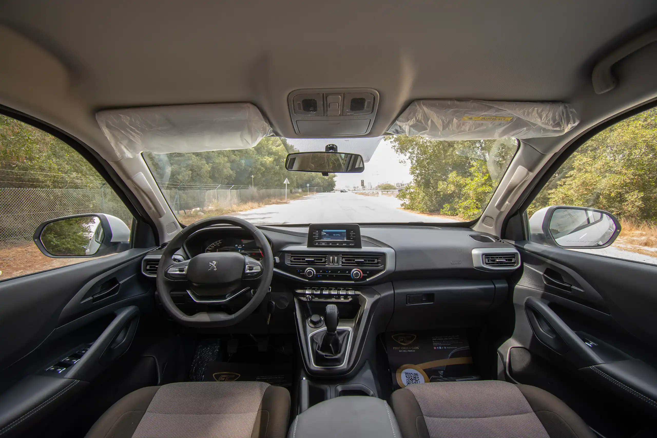 Used 2023 Peugeot Landtrek Double Cabin White – Front Cabin / Dashboard Full View at First Choice Cars Sharjah