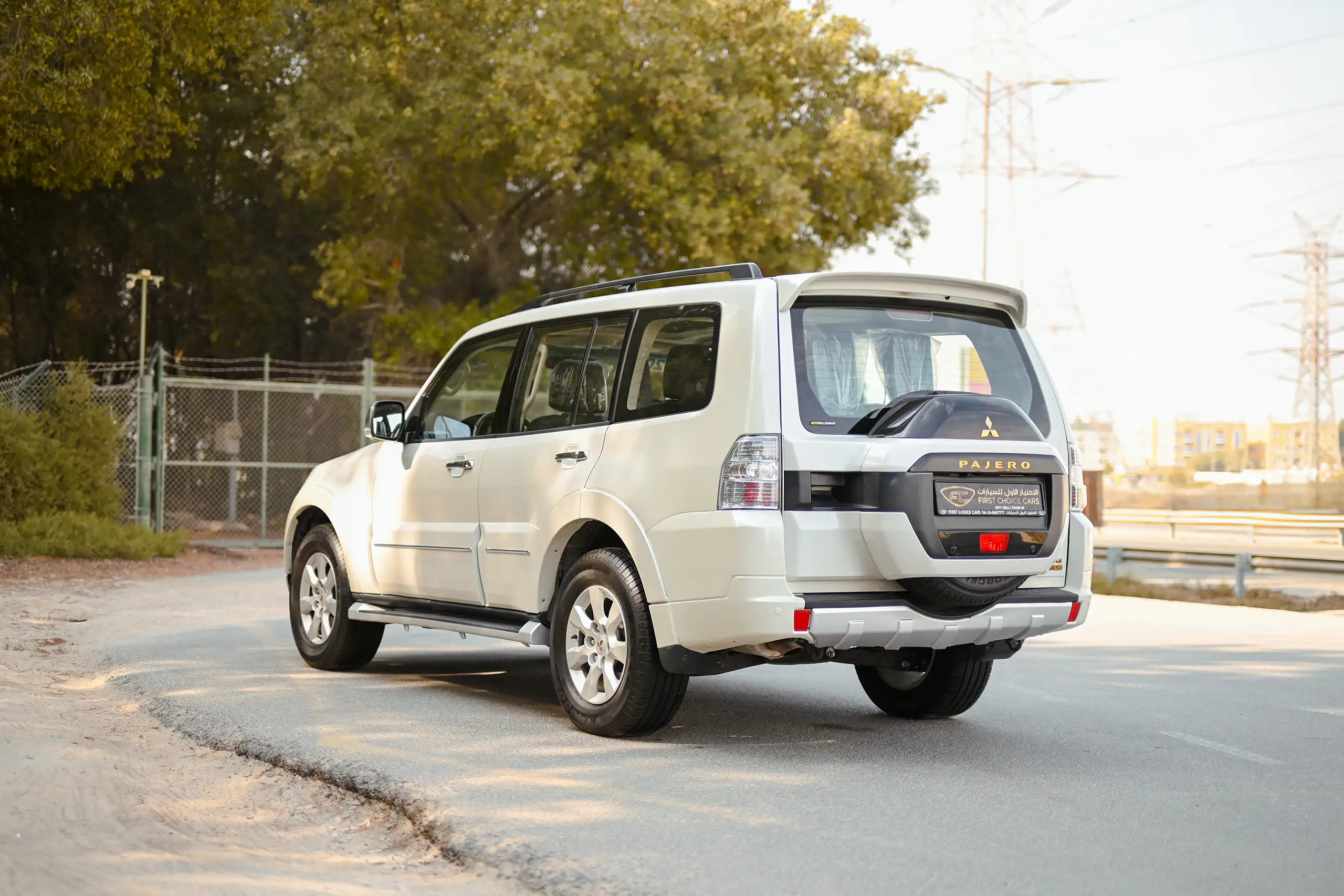 Used 2022 Mitsubishi PAJERO GLS White – Left Back Diagonal (45°) View at First Choice Cars Sharjah