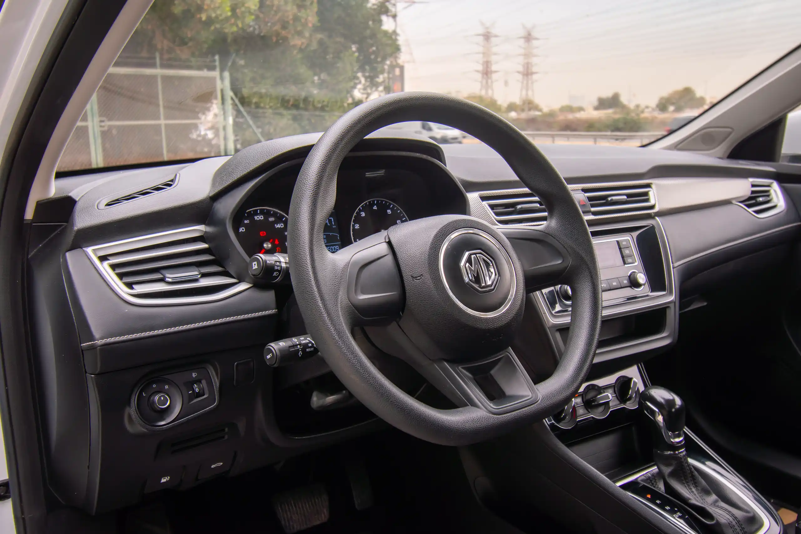 Used 2023 MG 5 Comfort White – Driver Side Dashboard & Steering View at First Choice Cars Sharjah