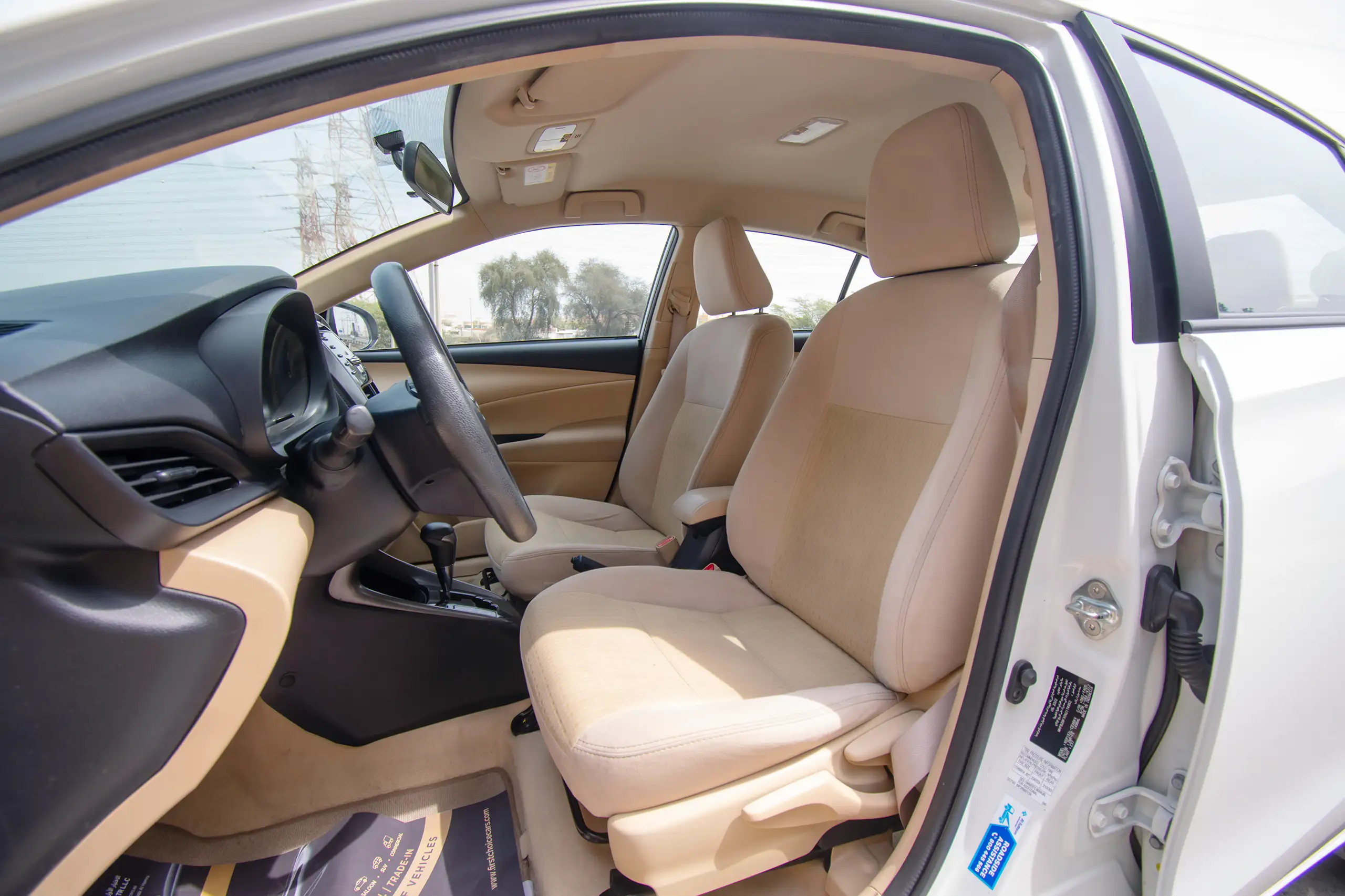 Used 2022 Toyota Yaris E in White – Front Driver Side Cabin View for Sale at First Choice Cars Dubai Sharjah