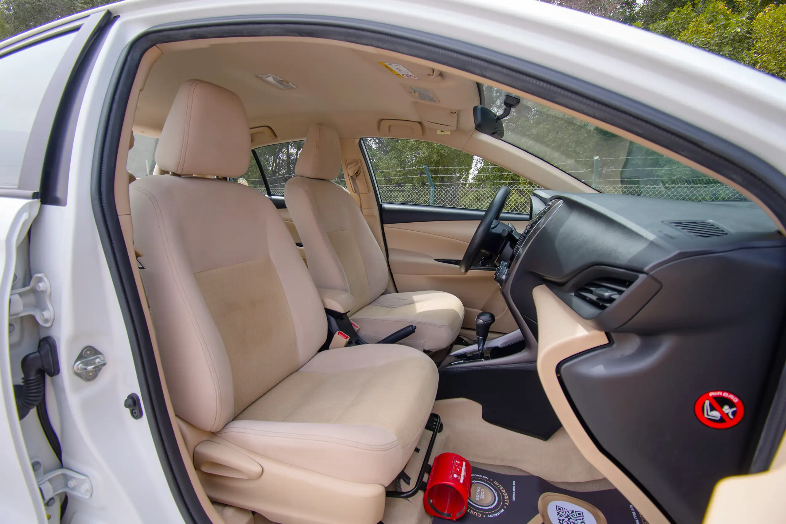 Used 2022 Toyota Yaris E in White – Front Passenger Side Cabin View for Sale at First Choice Cars Dubai Sharjah