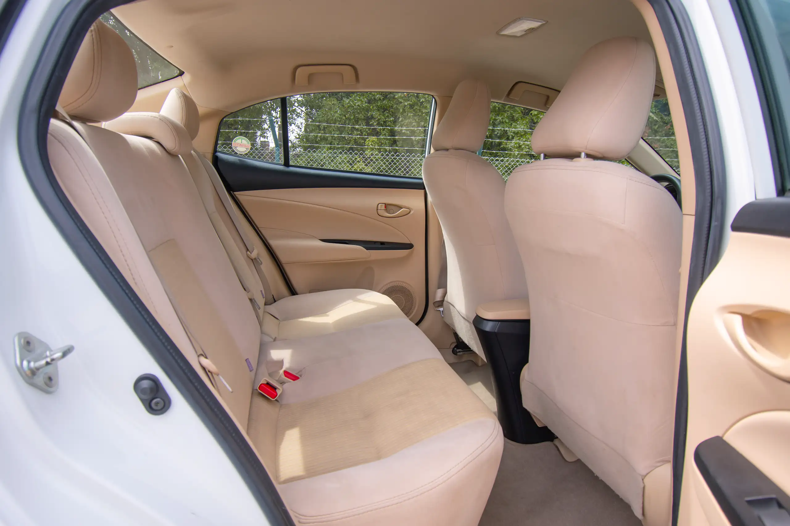 Used 2022 Toyota Yaris E in White – Rear Passenger Side Cabin View for Sale at First Choice Cars Dubai Sharjah