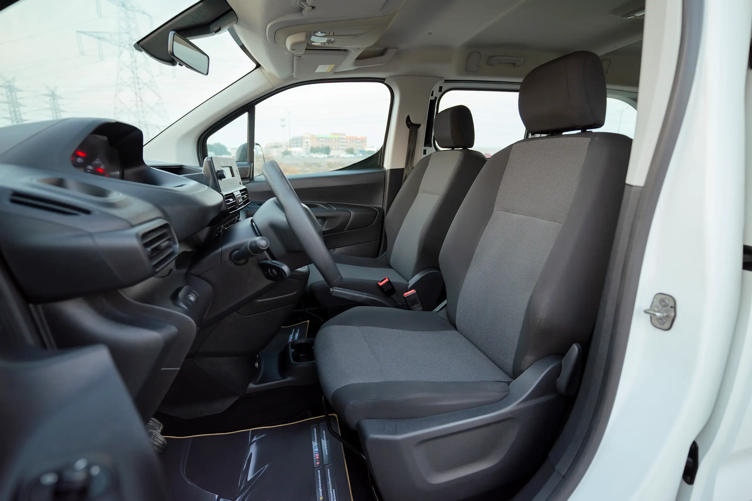 Used 2022 Peugeot Rifter Long White – Front Driver Side Cabin View at First Choice Cars Sharjah