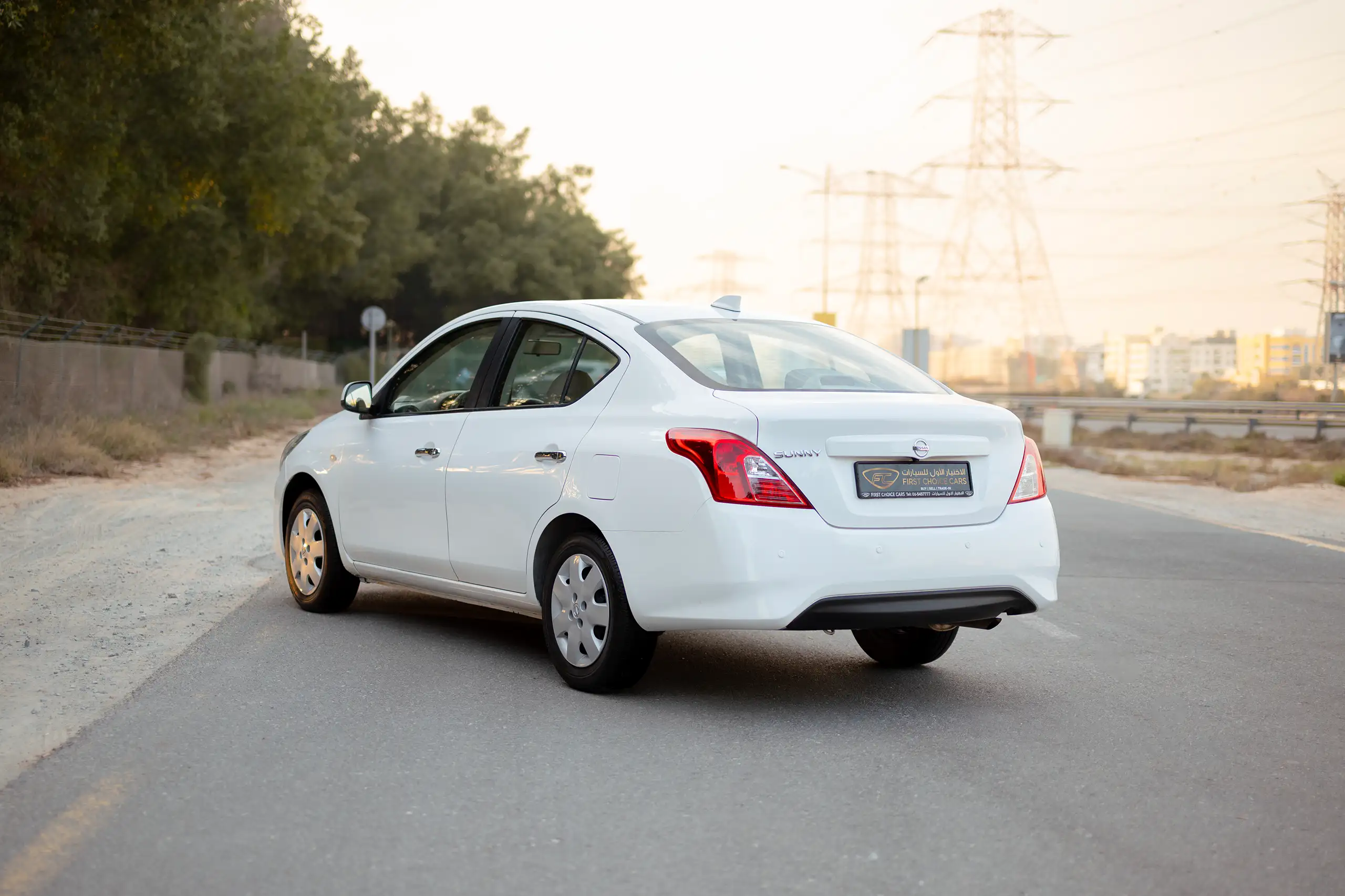 Used 2024 Nissan Sunny SV White – Left Back Diagonal (45°) View at First Choice Cars Sharjah
