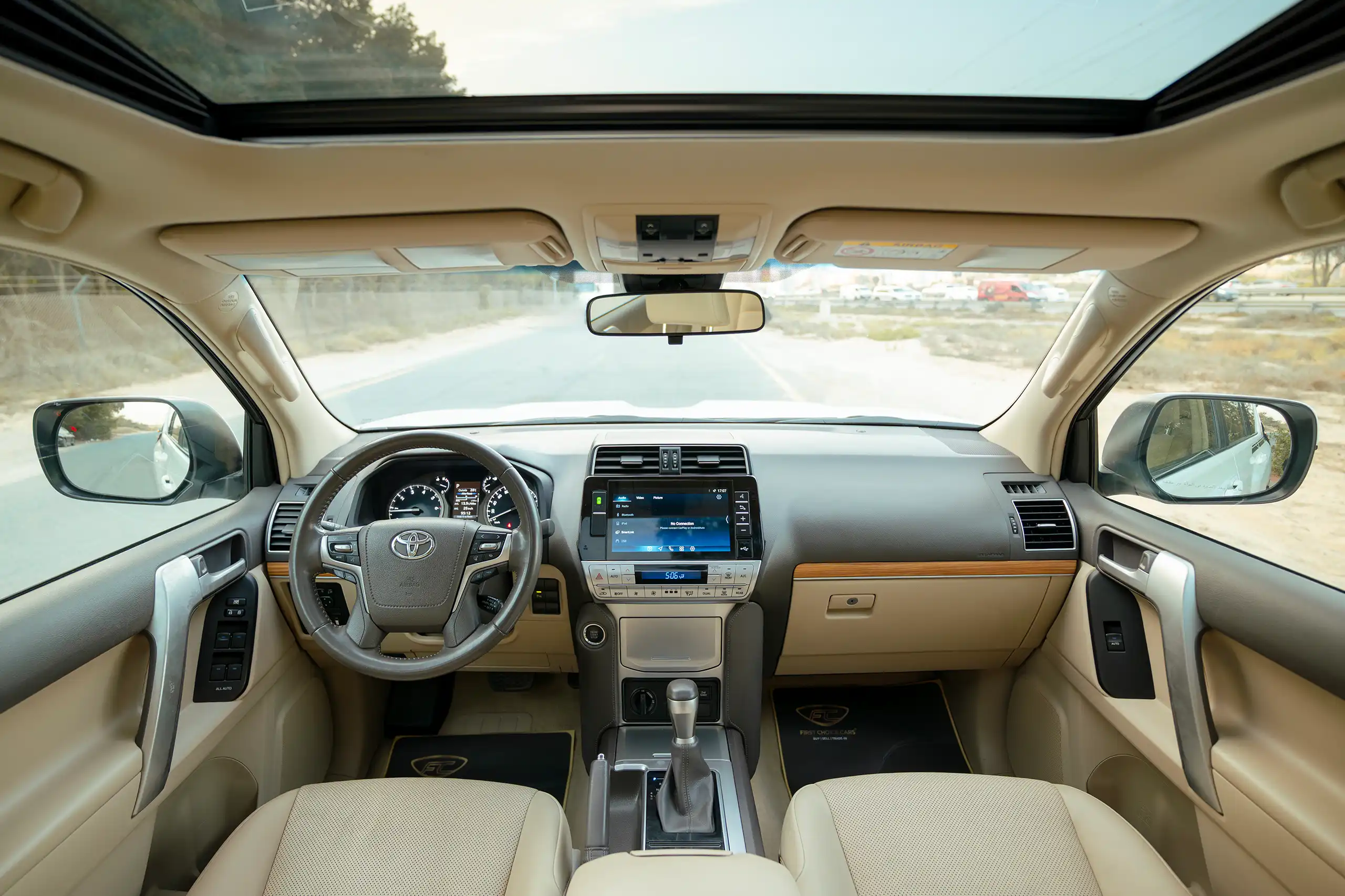 Used 2022 Toyota Prado VXR White – Front Cabin / Dashboard Full View at First Choice Cars Sharjah