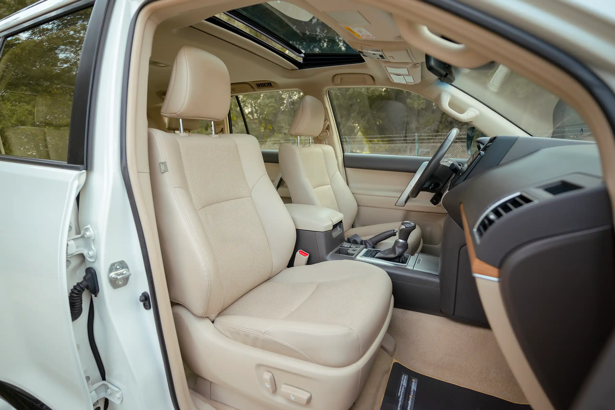 Used 2022 Toyota Prado VXR White – Front Passenger Side Cabin View at First Choice Cars Sharjah