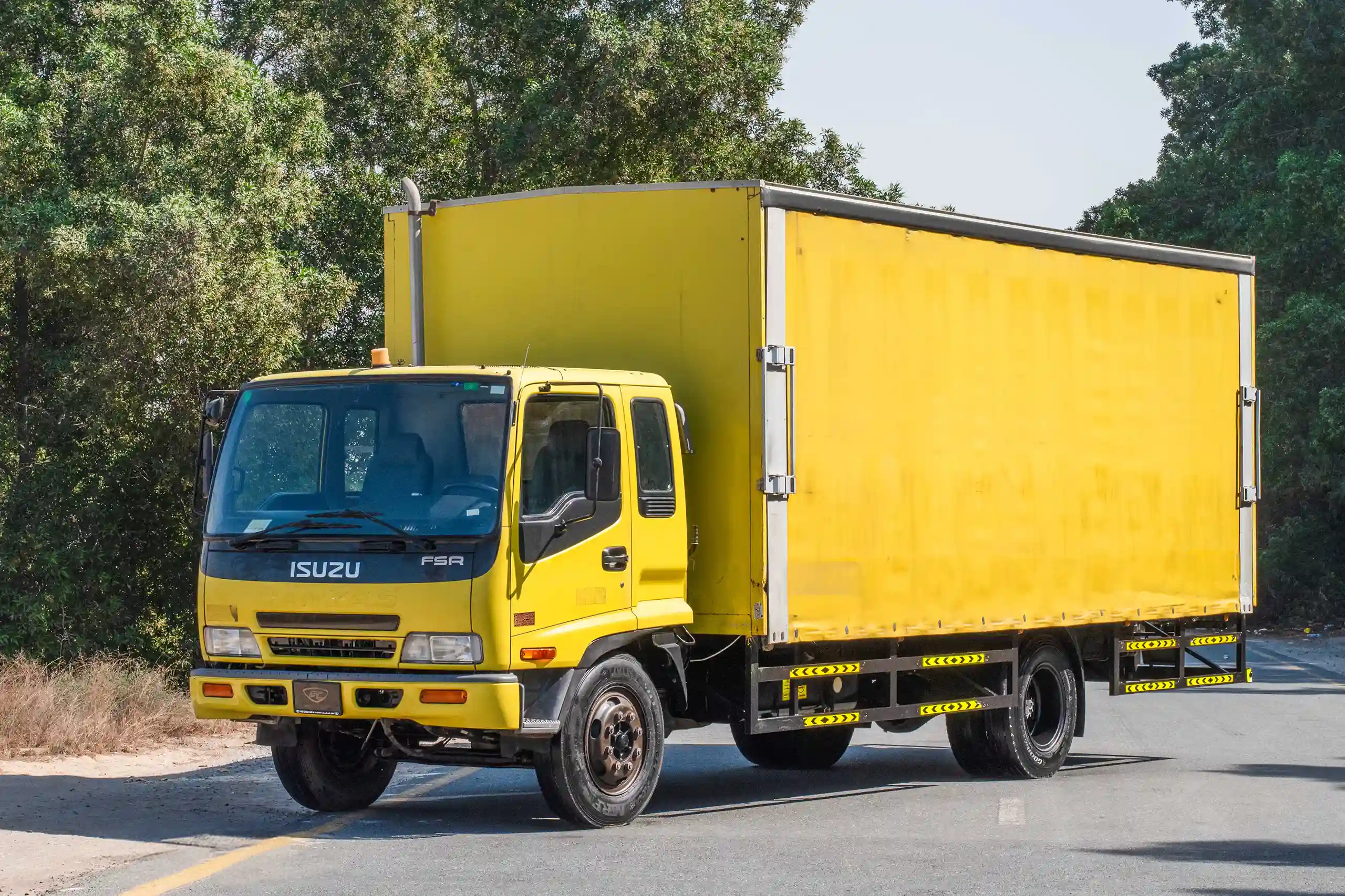 Used 2016 Isuzu FSR Cargo Body Yellow – Left Front Diagonal (45°) View at First Choice Cars Sharjah