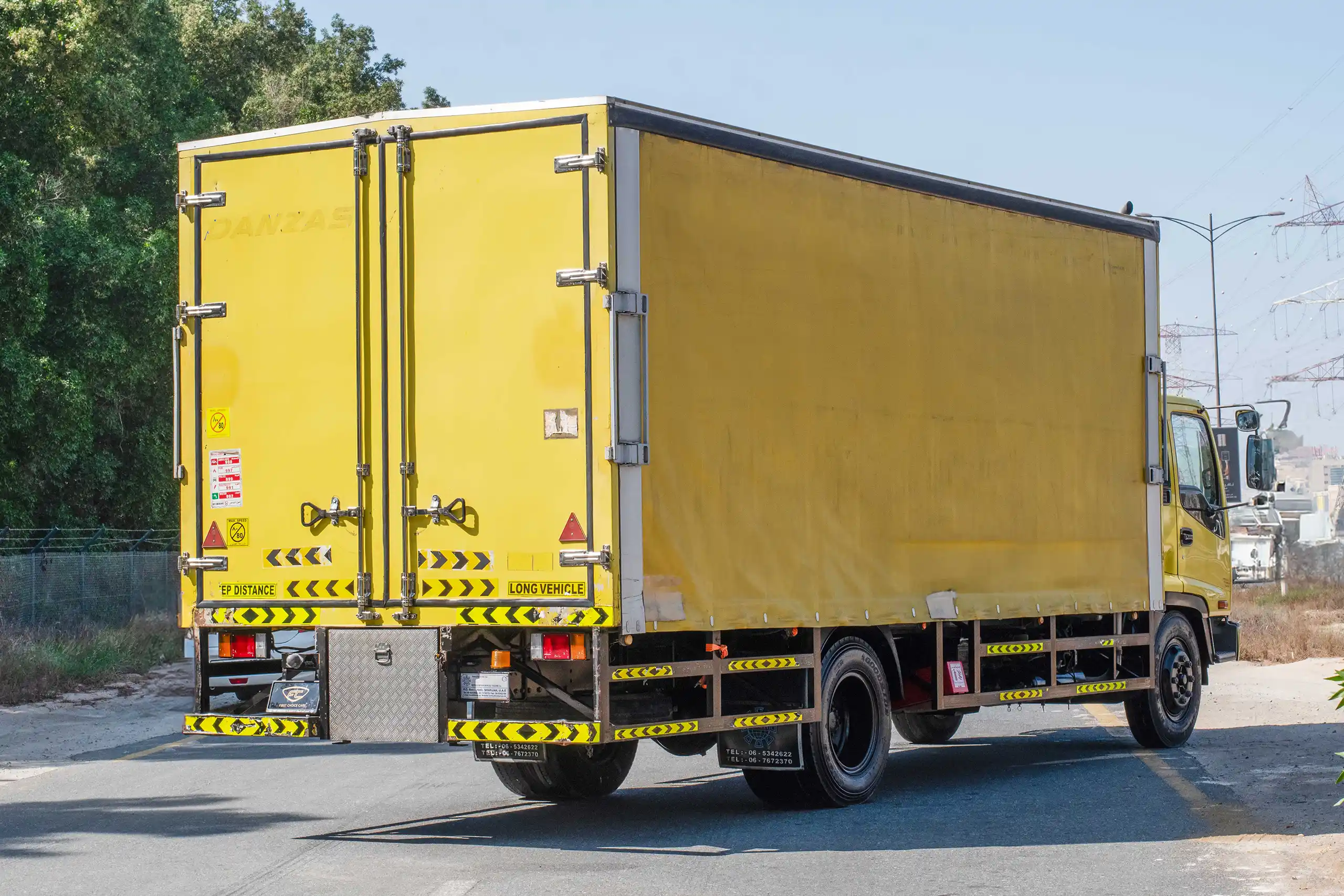 Used 2016 Isuzu FSR Cargo Body Yellow – Right Back Diagonal (45°) View at First Choice Cars Sharjah