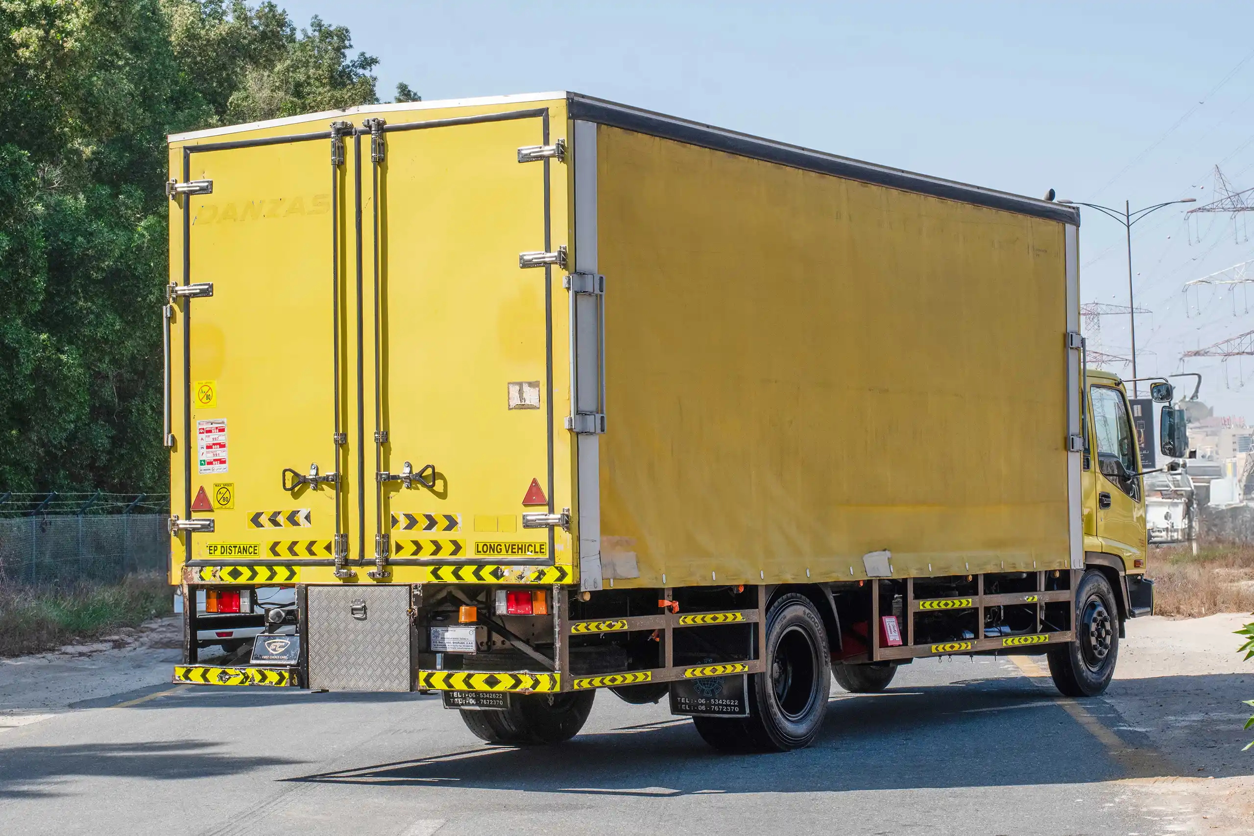Used 2016 Isuzu FSR Cargo Body Yellow – Right Back Diagonal (45°) View at First Choice Cars Sharjah