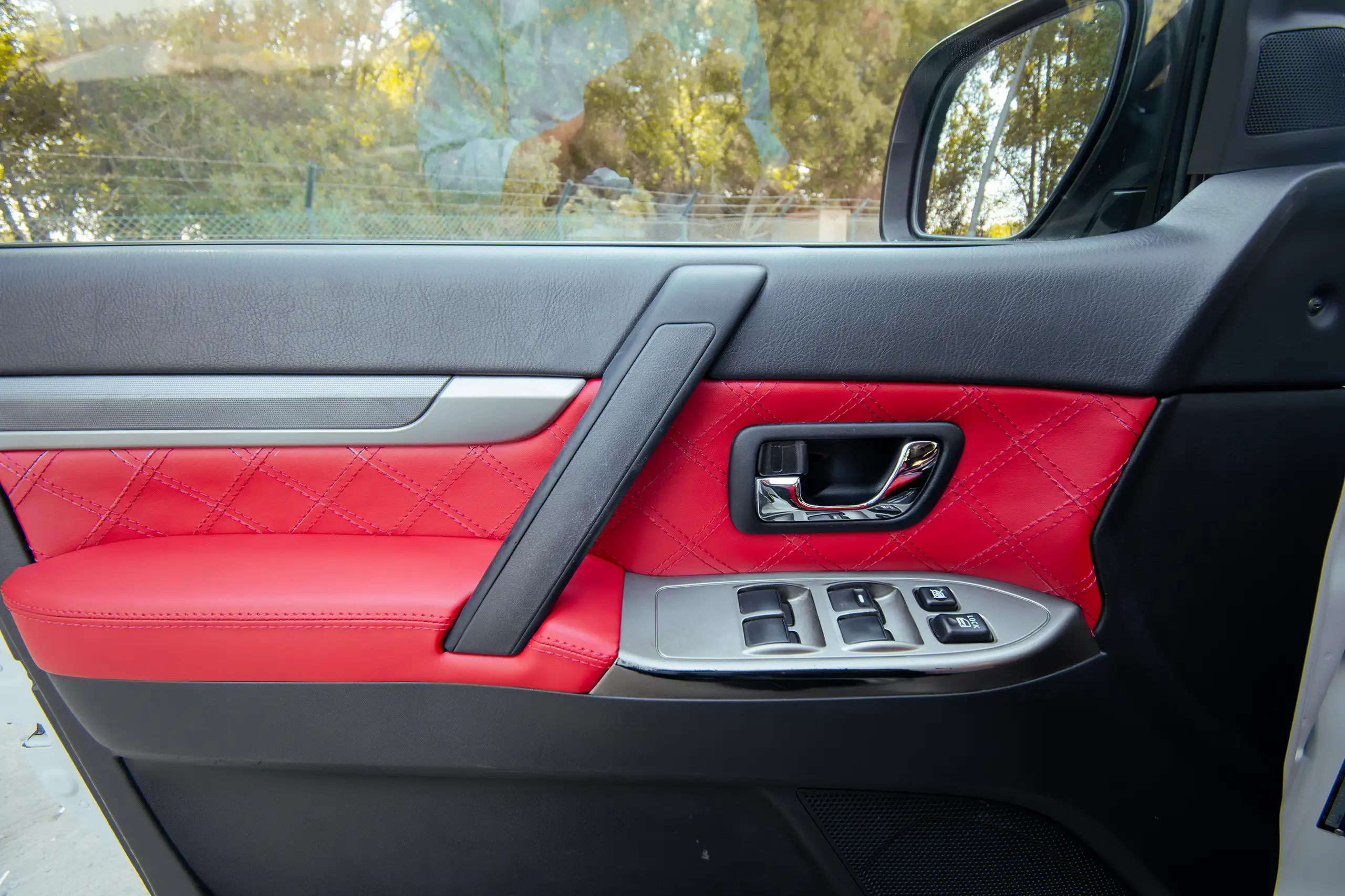 Used 2022 Mitsubishi Pajero GLS White – Driver Door Panel Full View at First Choice Cars Sharjah