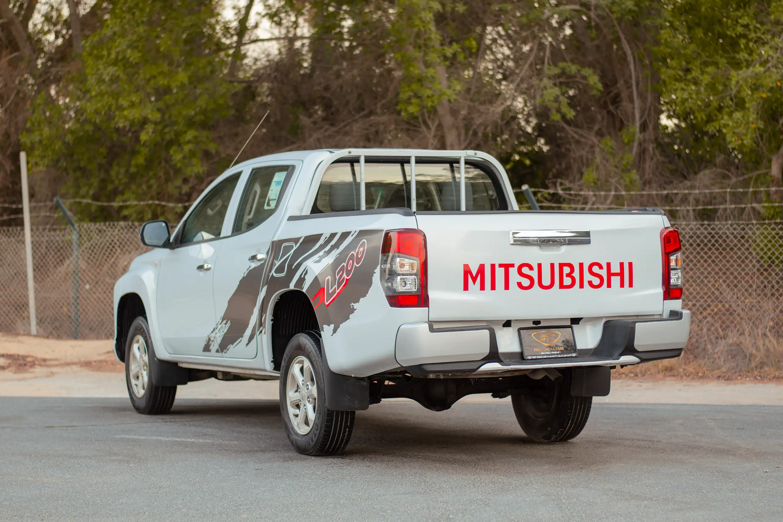 Used 2020 Mitsubishi L200 GLX Double Cabin White – Left Back Diagonal (45°) View at First Choice Cars Sharjah