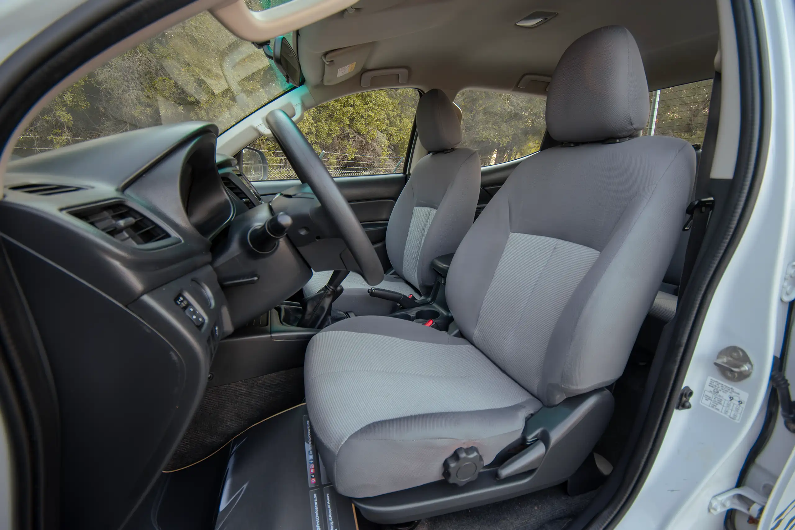 Used 2020 Mitsubishi L200 GLX Double Cabin White – Front Driver Side Cabin View at First Choice Cars Sharjah